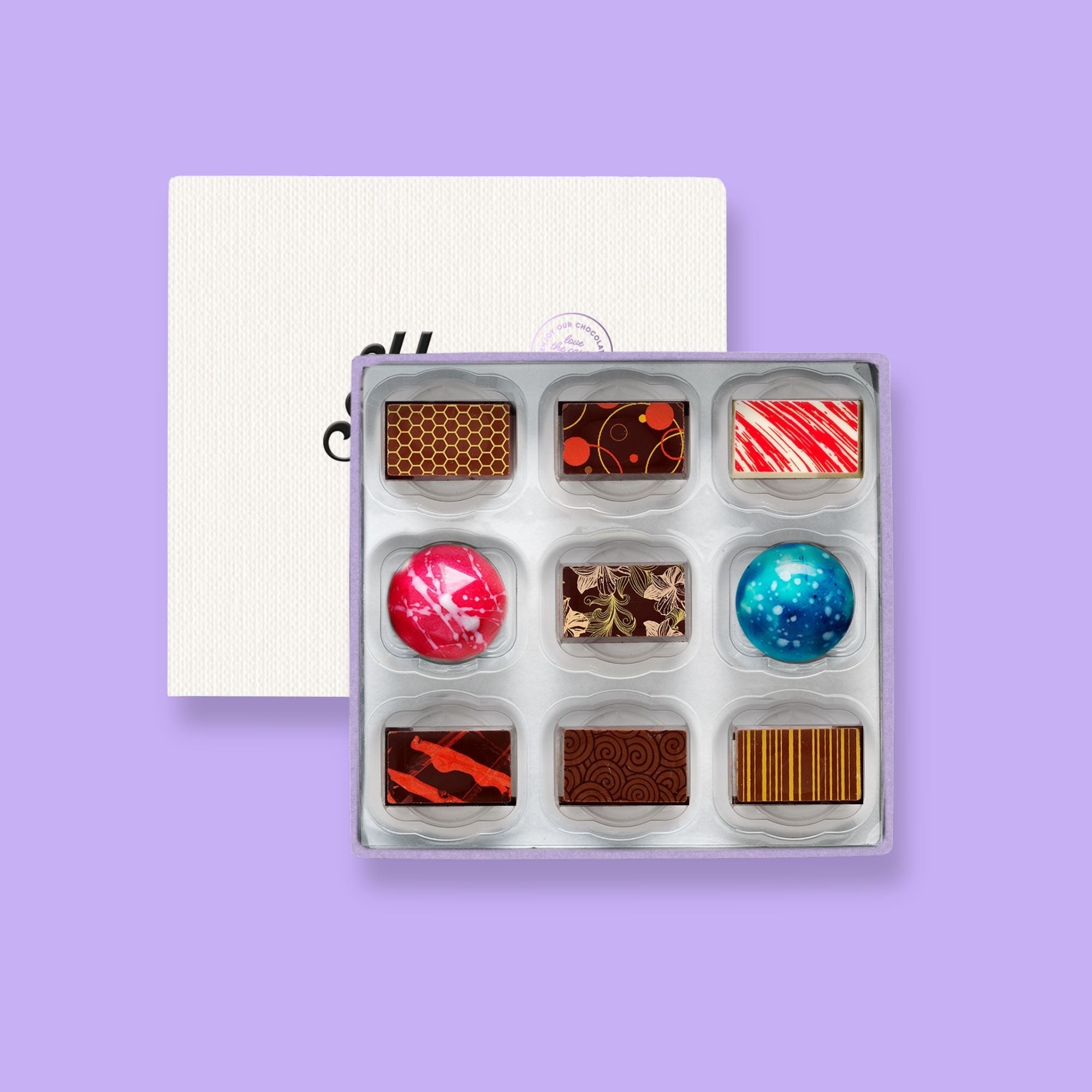 A Harry Specters subscription box of 9 colourfully decorated luxury chocolates