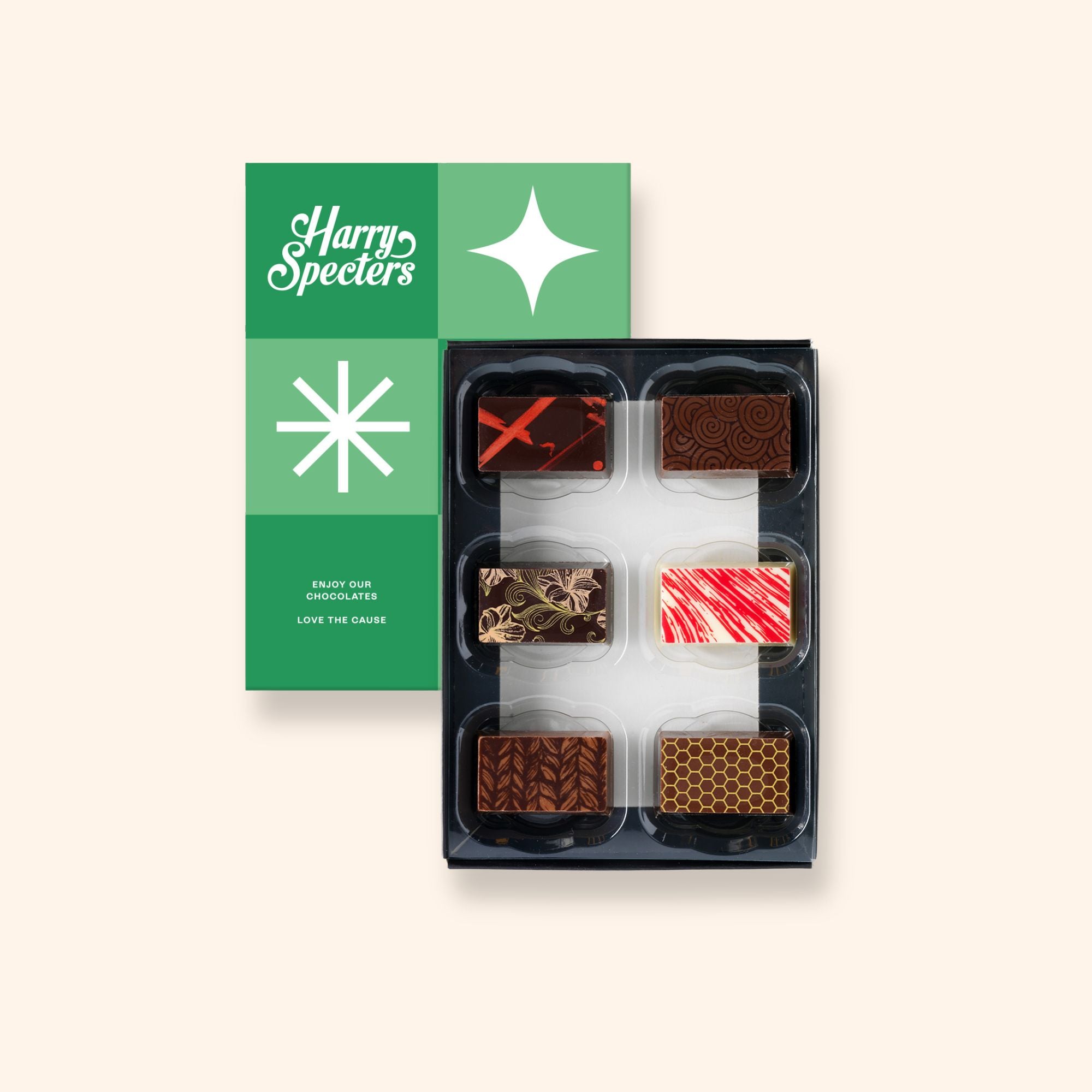 A box of 6 artisan chocolates colourfully decorated