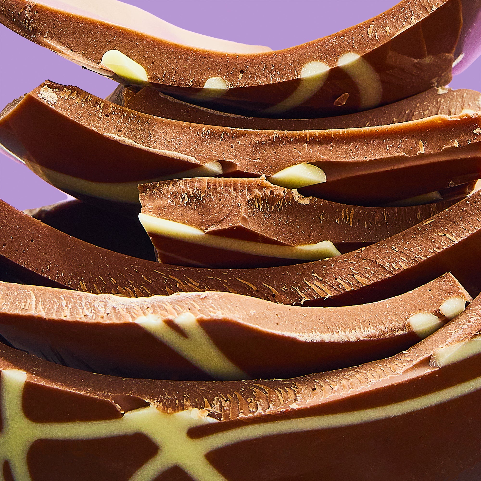 A stack of caramel chocolate luxury Easter egg pieces