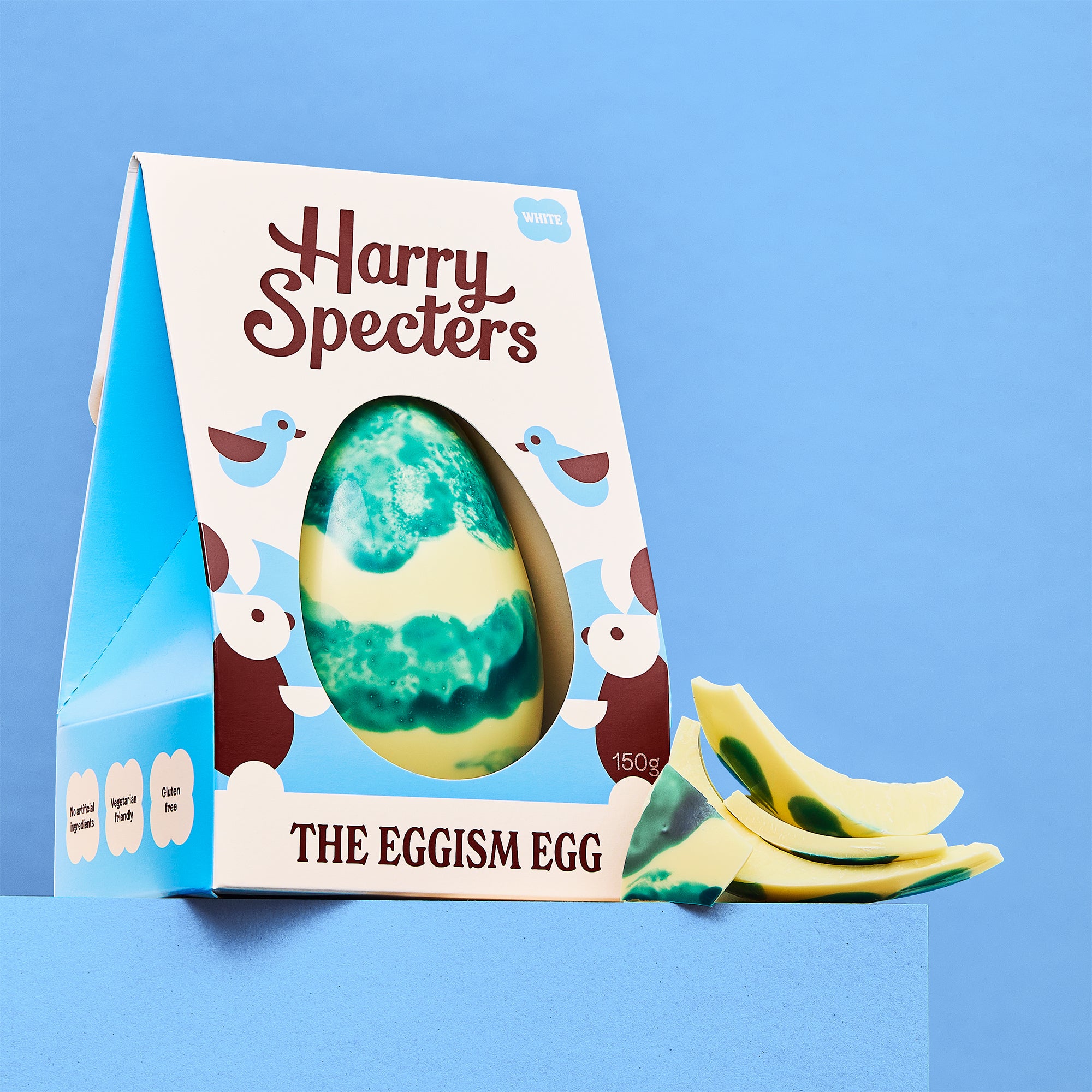 The Eggism Egg is a white chocolate luxury Easter egg shown on a blue background