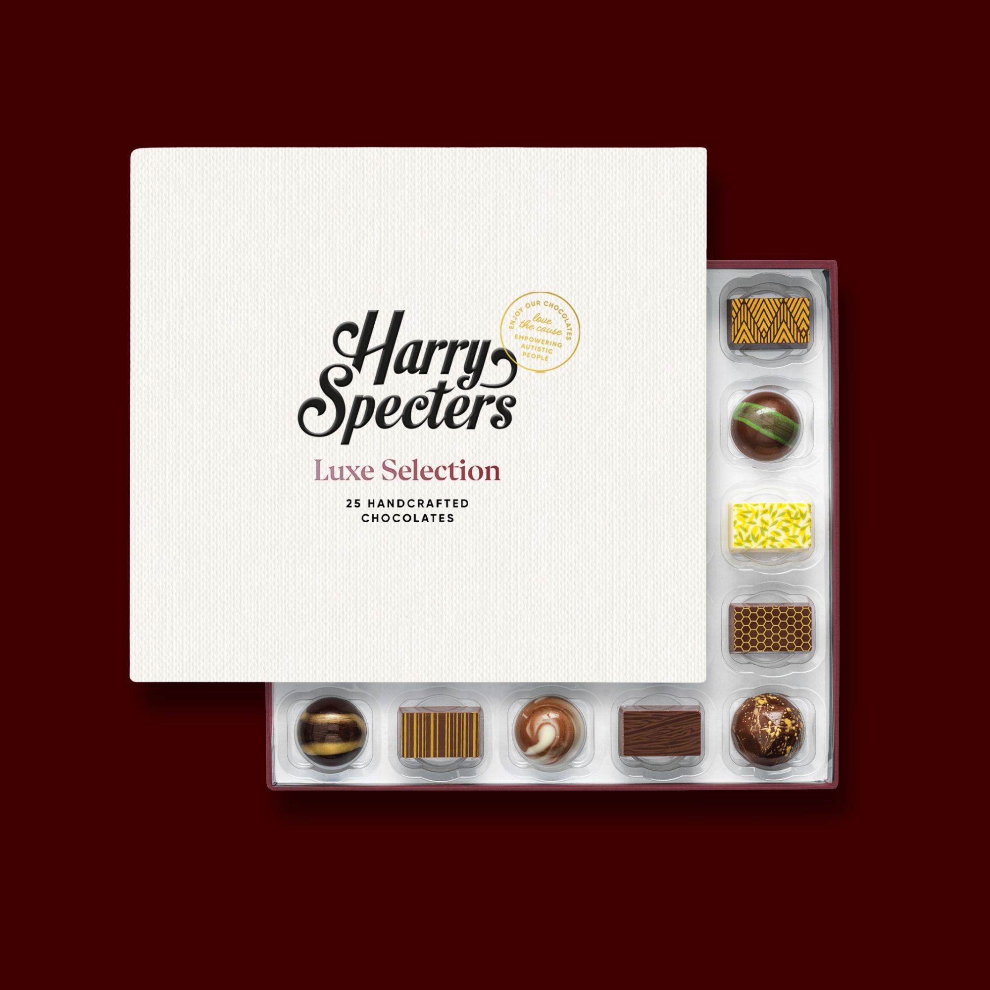 A box of 25 premium artisan chocolates partially covered by a lid