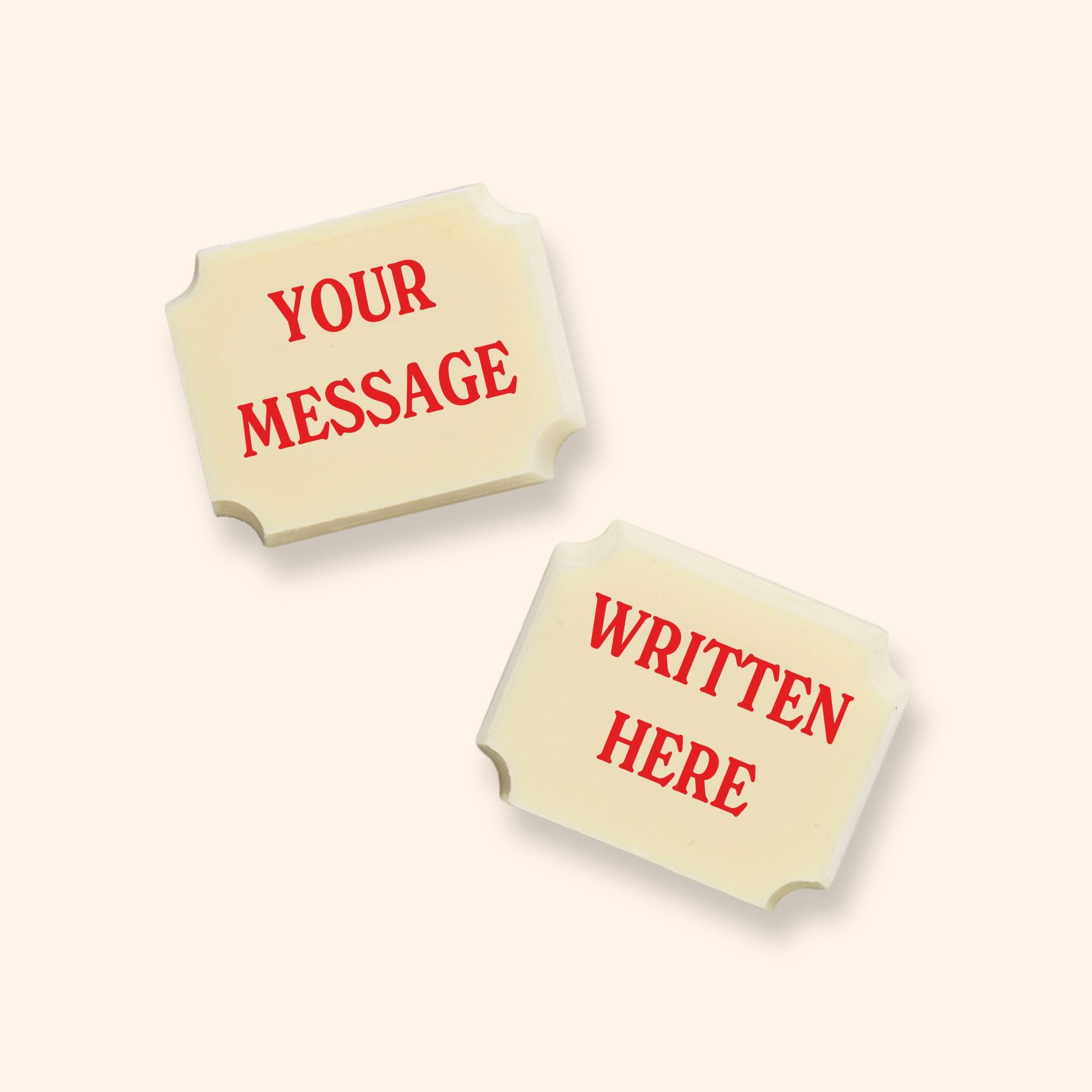 Two personalised luxury white chocolates which read 'your message written here'