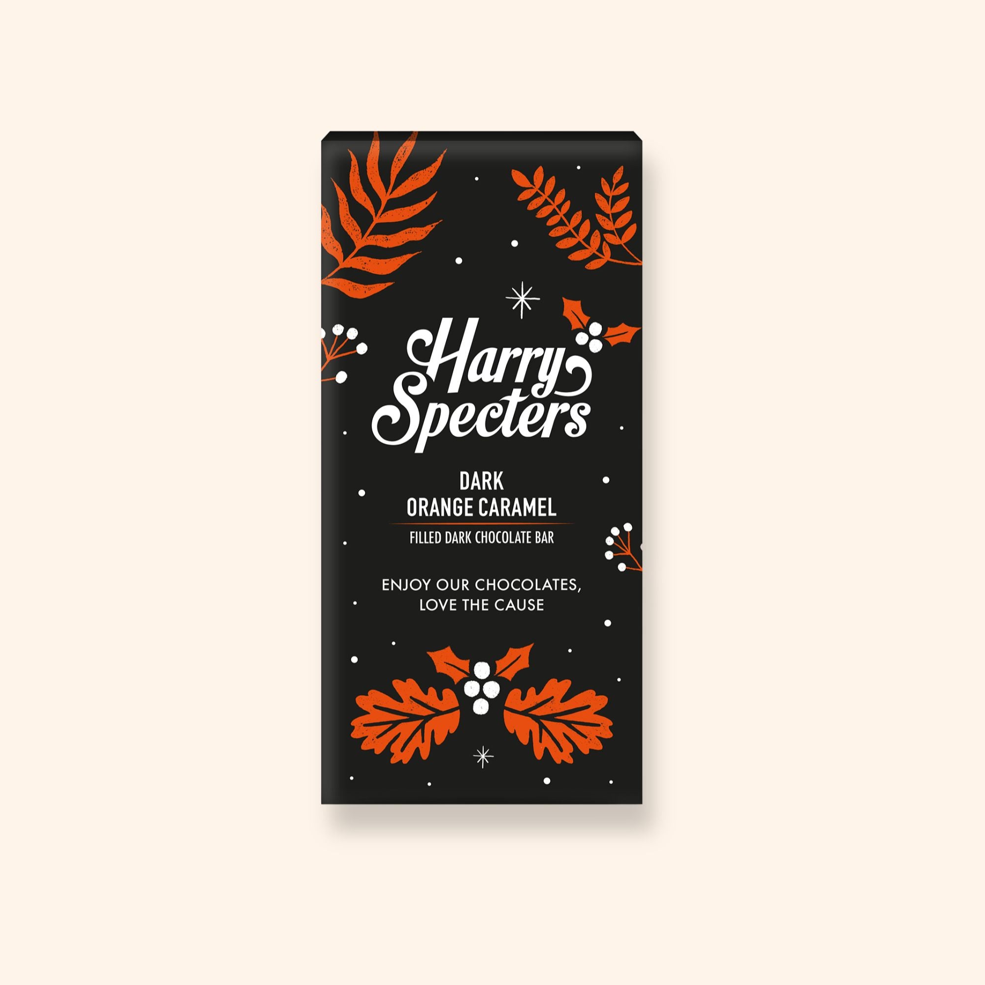 A Harry Specters dark chocolate bar filled with orange caramel in festive Christmas packaging