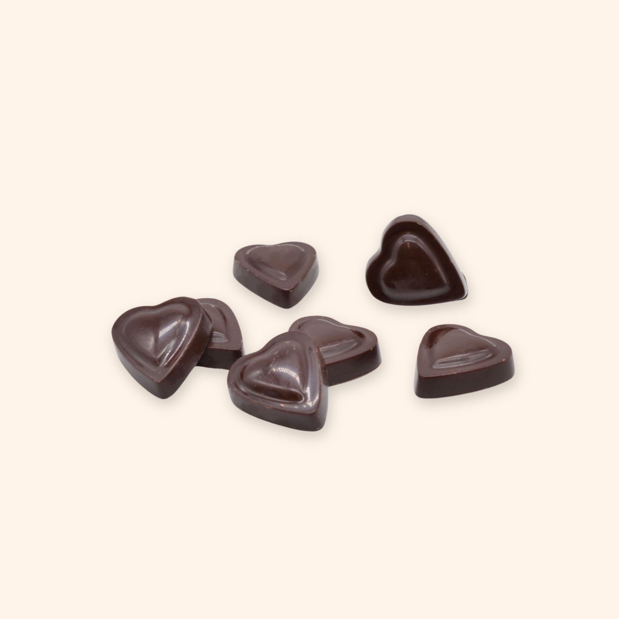 A pile of vegan dark chocolate heart shapes for Valentine's Day