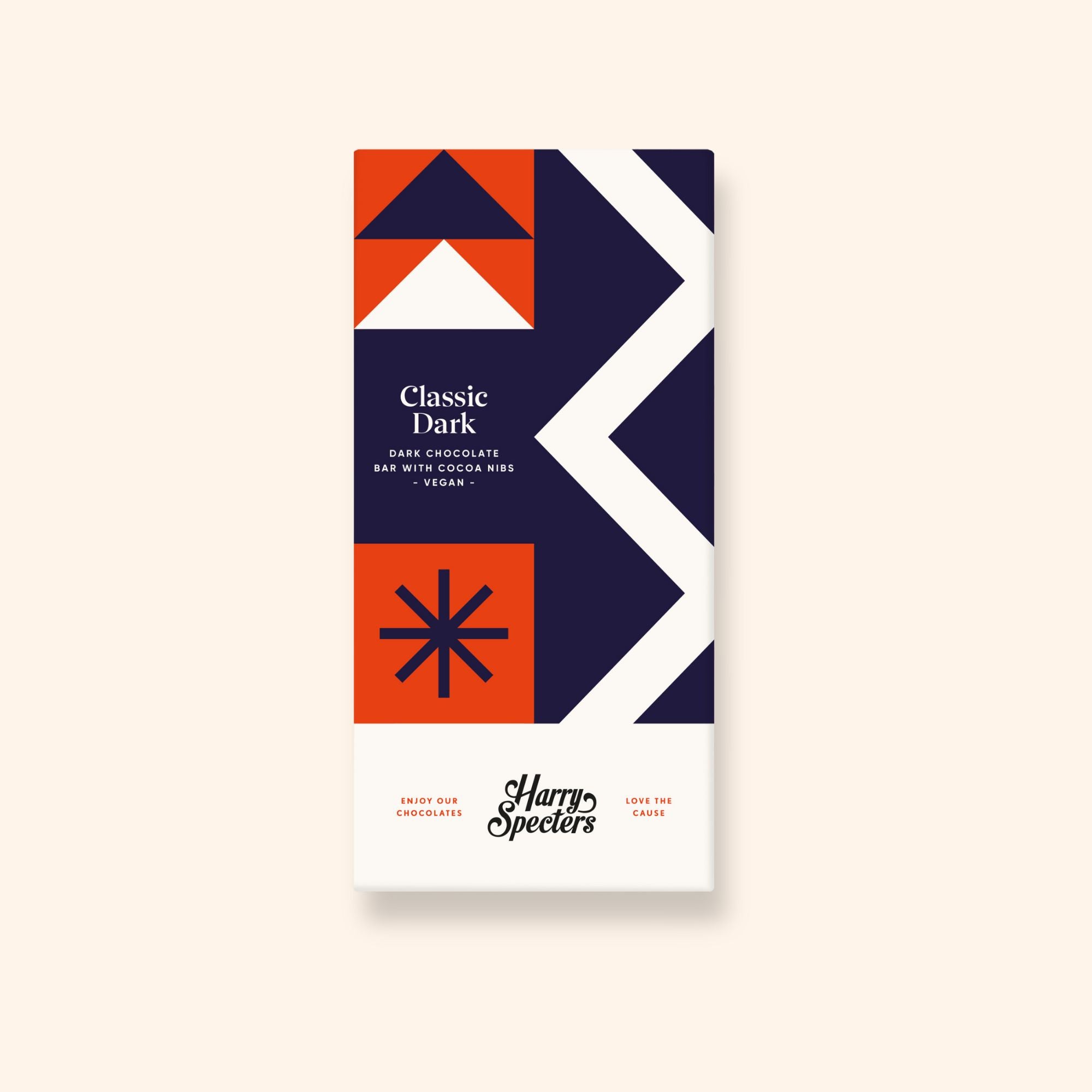 A vegan dark chocolate bar by Harry Specters decorated with cocoa nibs shown in colourful packaging