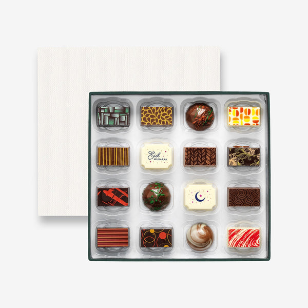 A box of 16 artisan chocolates colourfully decorated and featuring two Eid Mubarak themed designs