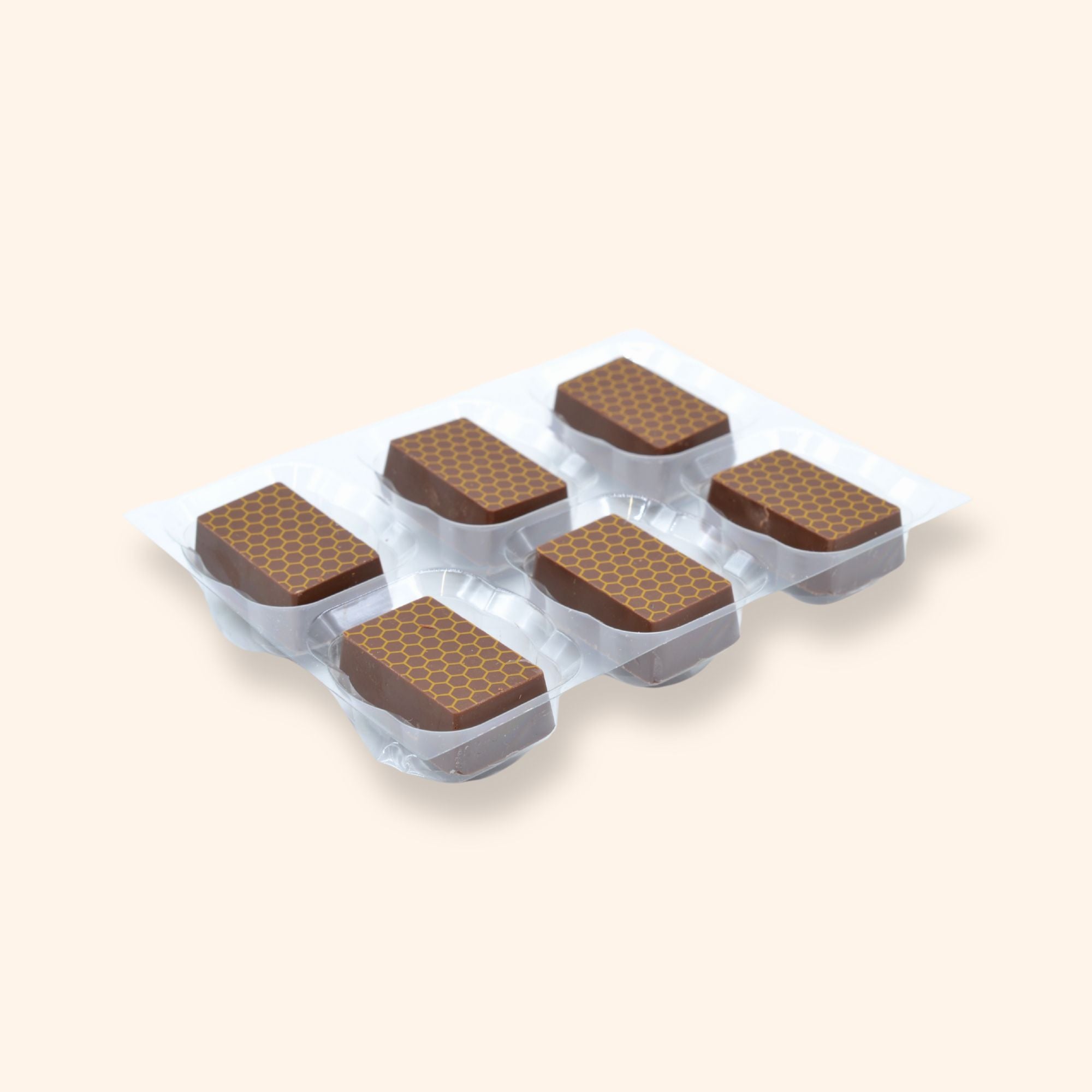 A tray of 6 handcrafted honey filled milk chocolates