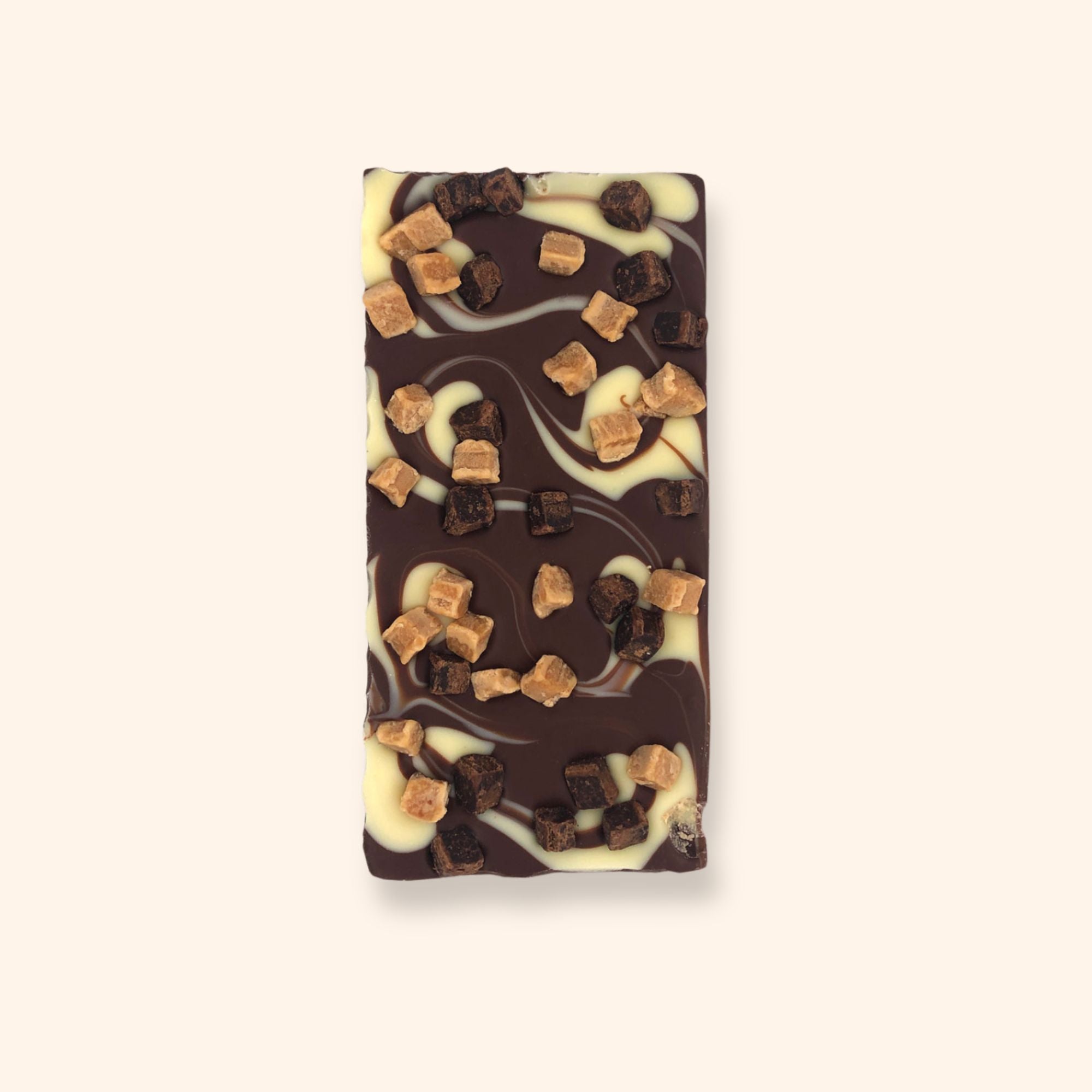 A milk chocolate bar with white chocolate swirl and Caramel & Brownie pieces