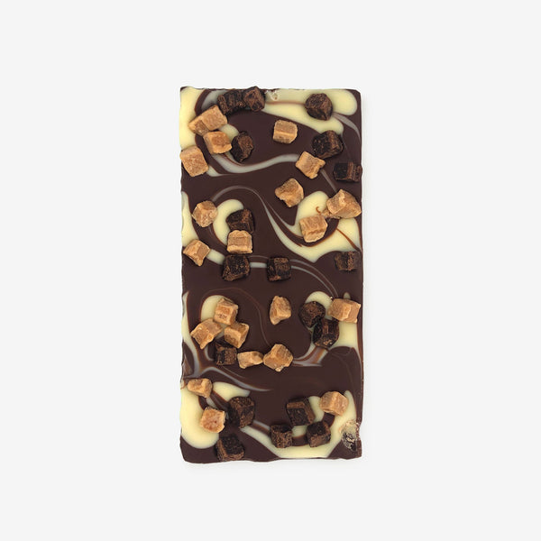 A milk chocolate bar with white chocolate swirl and Caramel & Brownie pieces