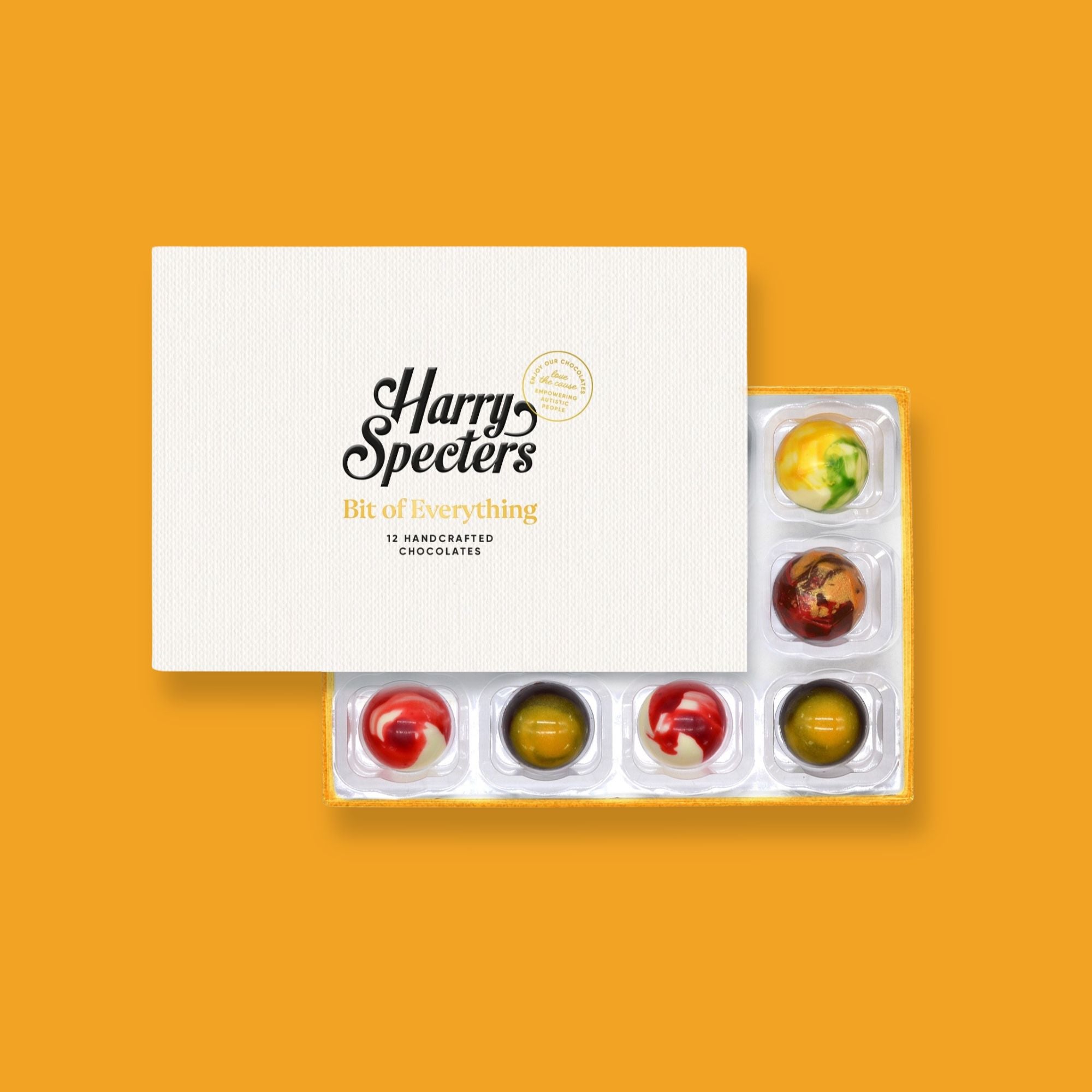 A lidded box of 12 colourfully decorated artisan chocolates with summer flavours