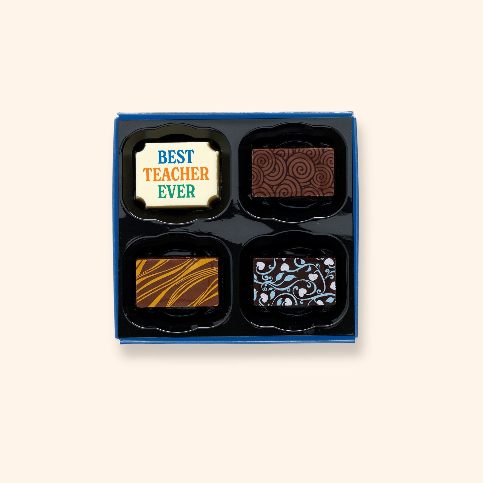 A box of 4 artisan chocolates colourfully decorated and featuring one Teacher gift themed design