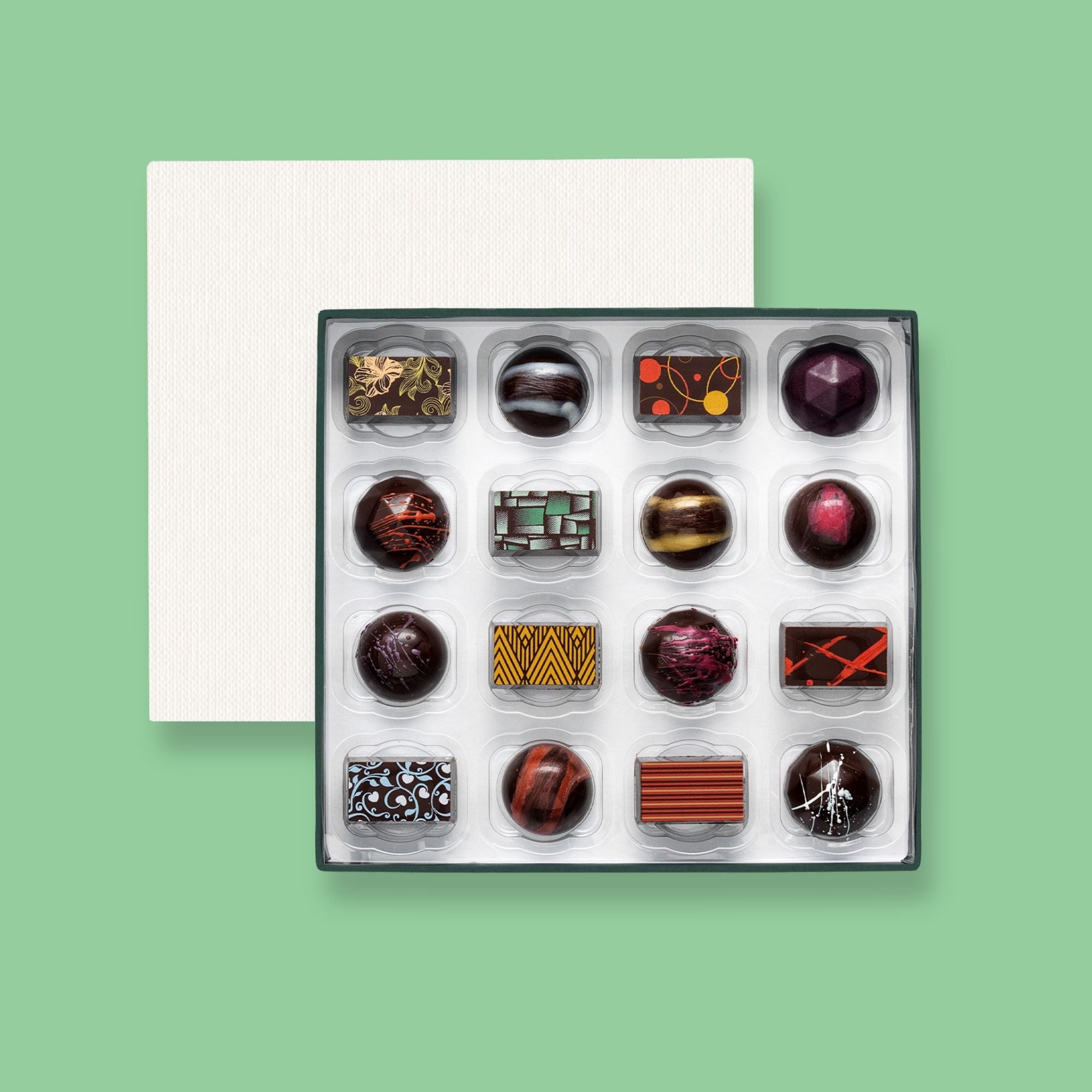 A box of 16 artisan vegan chocolates colourfully decorated
