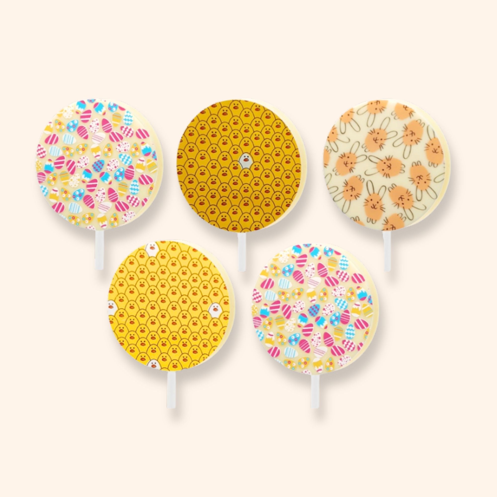 5 white chocolate lollipops featuring Easter designs including Easter eggs, chicks, and bunnies