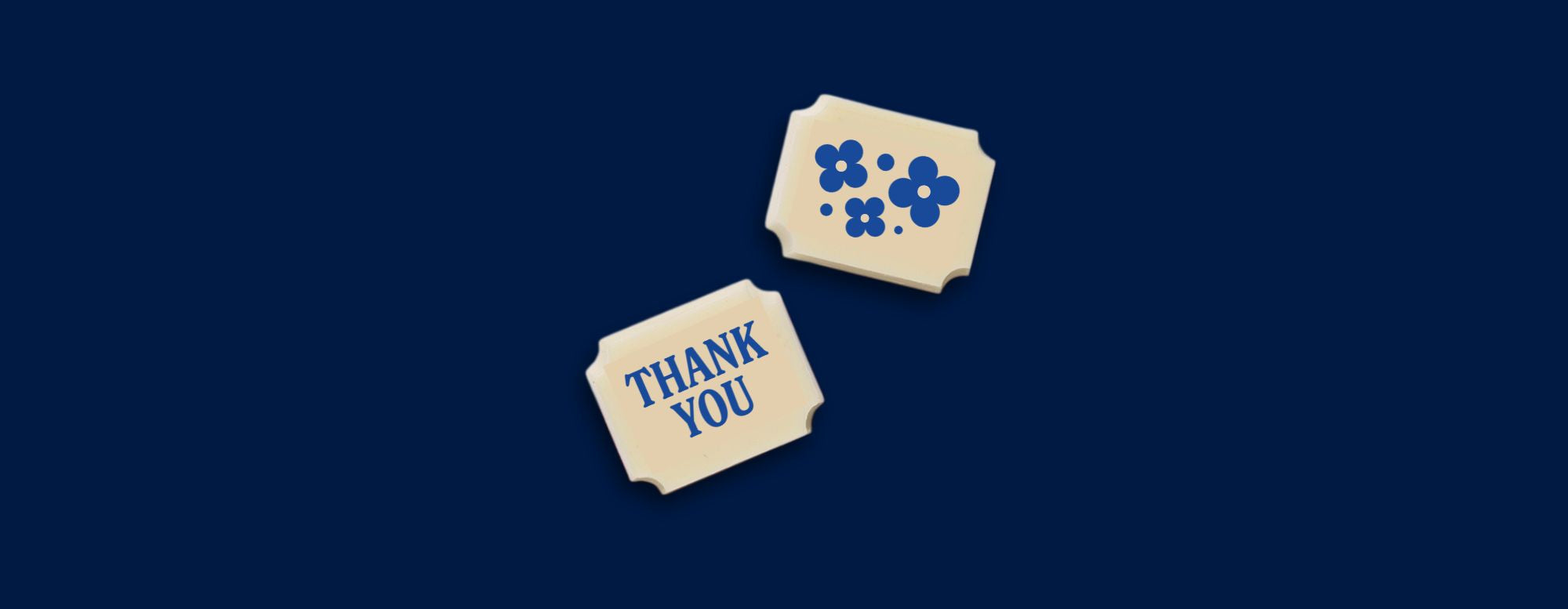 Two white chocolates with Thank You messages