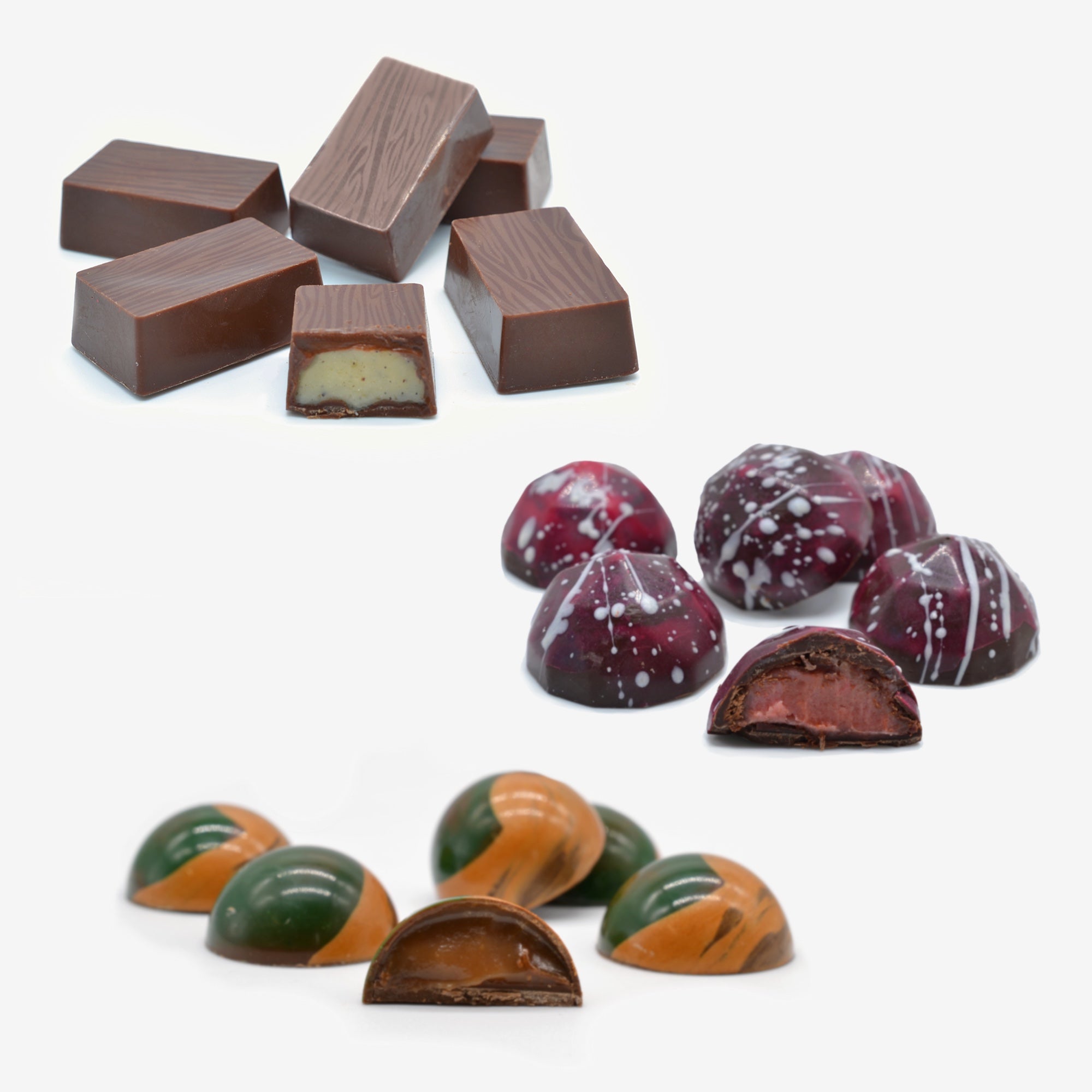 Assorted chocolates including dark chocolate and marbled truffles on a white background