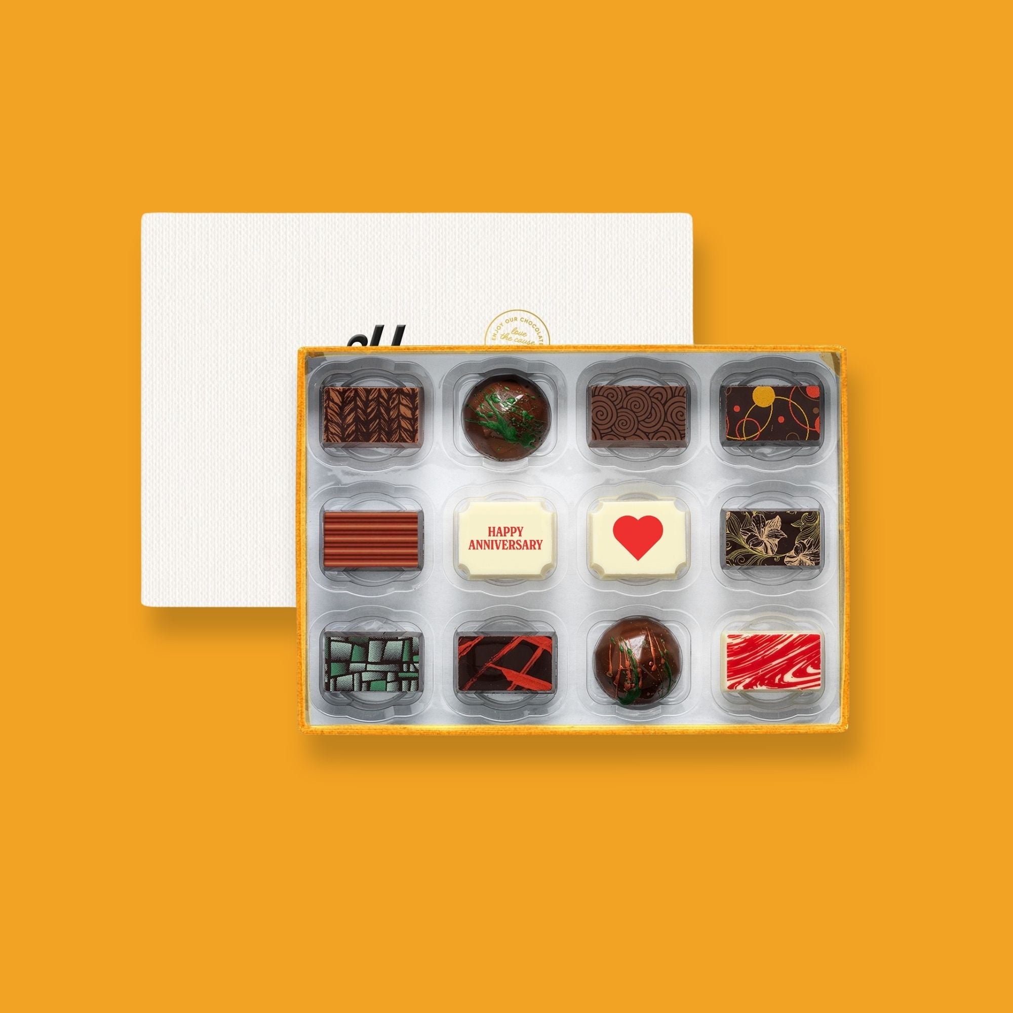 A box of 12 premium Anniversary chocolates crafted by artisan chocolatiers