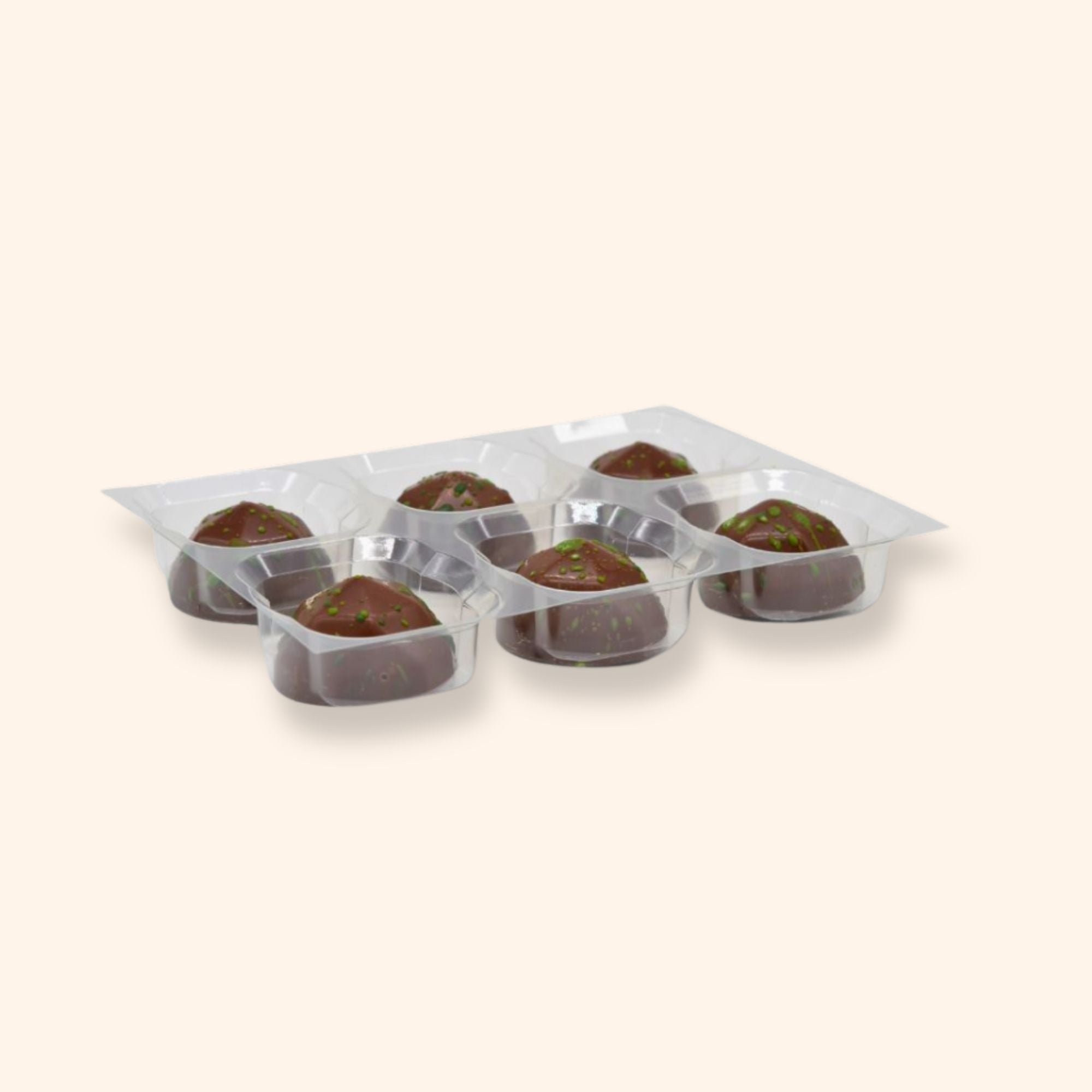 A tray of 6 apple cinnamon milk chocolates  