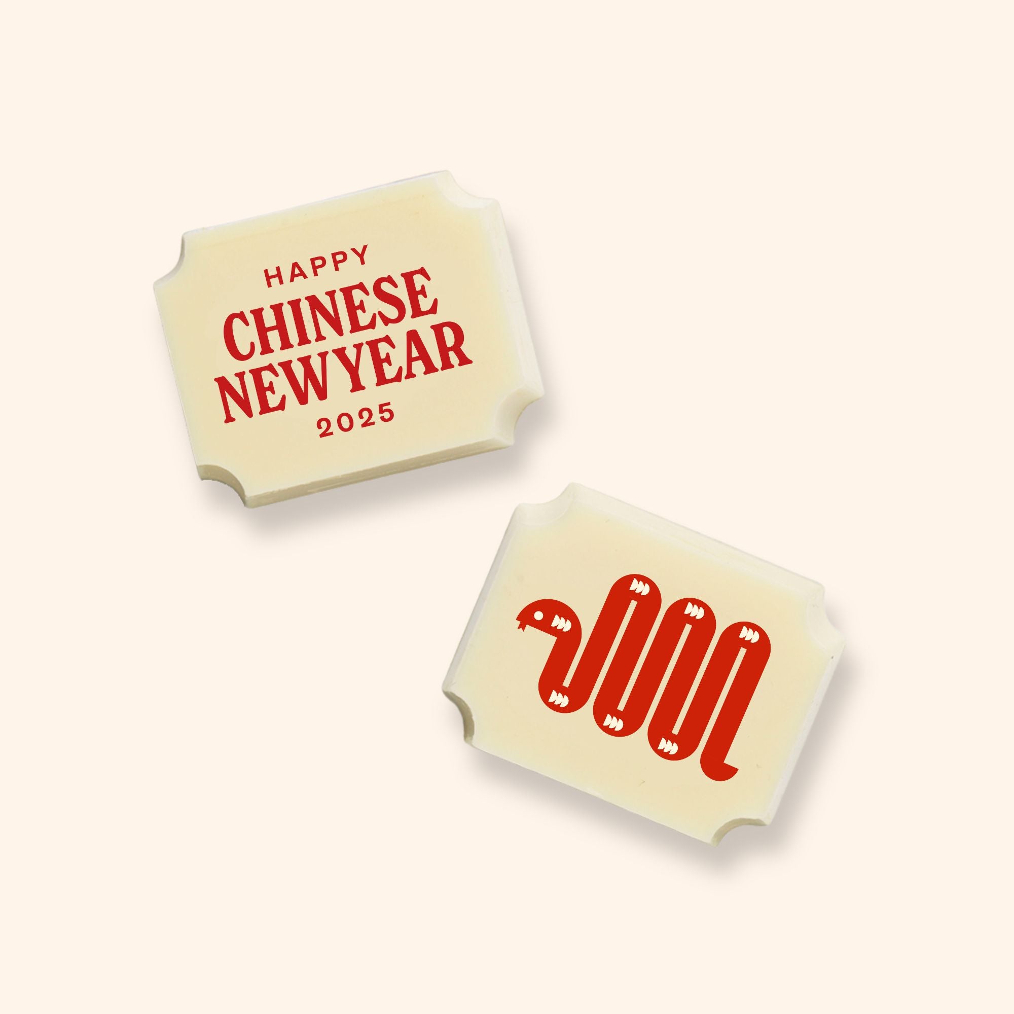 Two luxury white chocolates with a Chinese New Year message