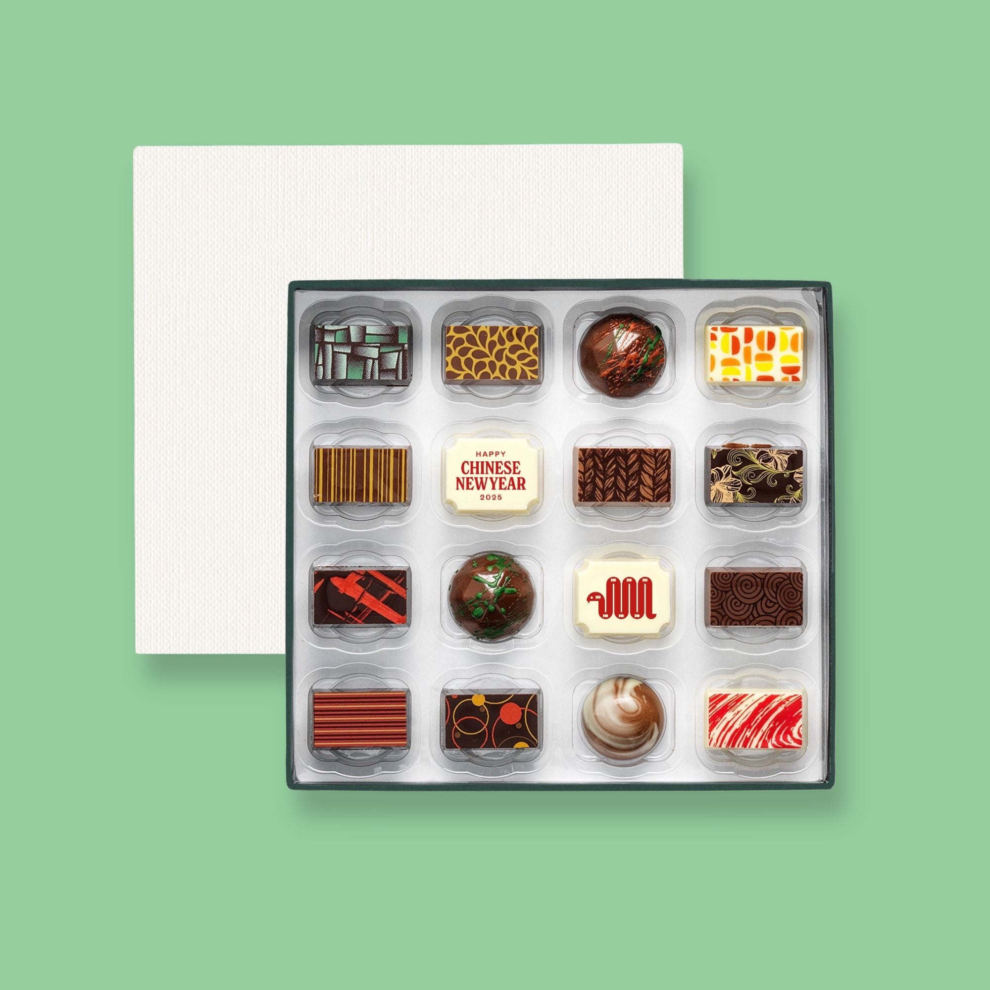 A box of 16 artisan chocolates colourfully decorated and featuring two Chinese New Year themed designs