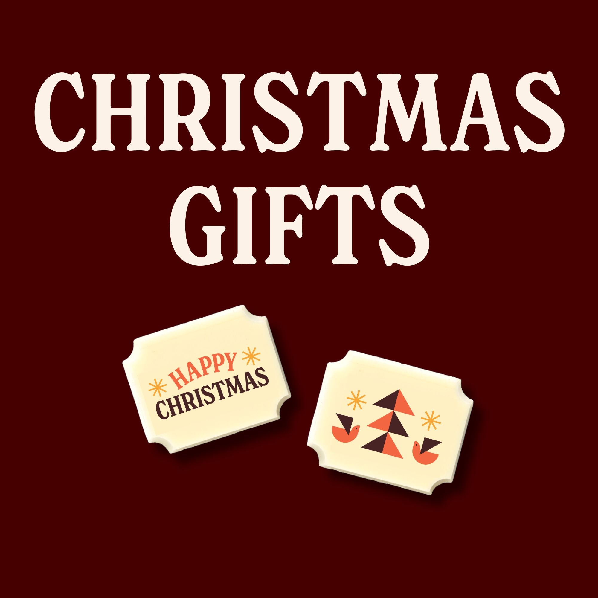 Two luxury white chocolates on a brown background with the words 'Christmas Gifts'