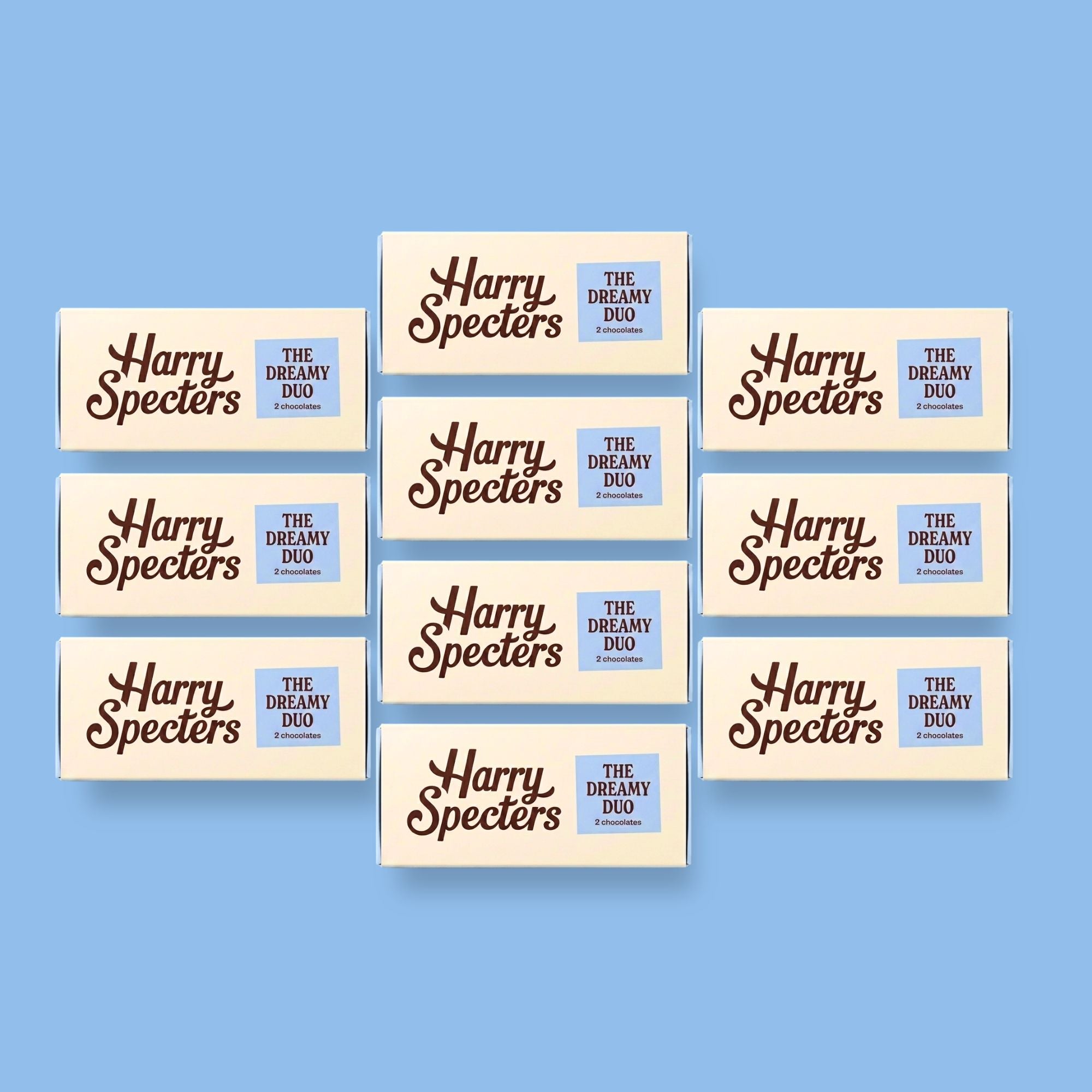 Multiple boxes of 'Harry Specters' premium chocolates on a blue background