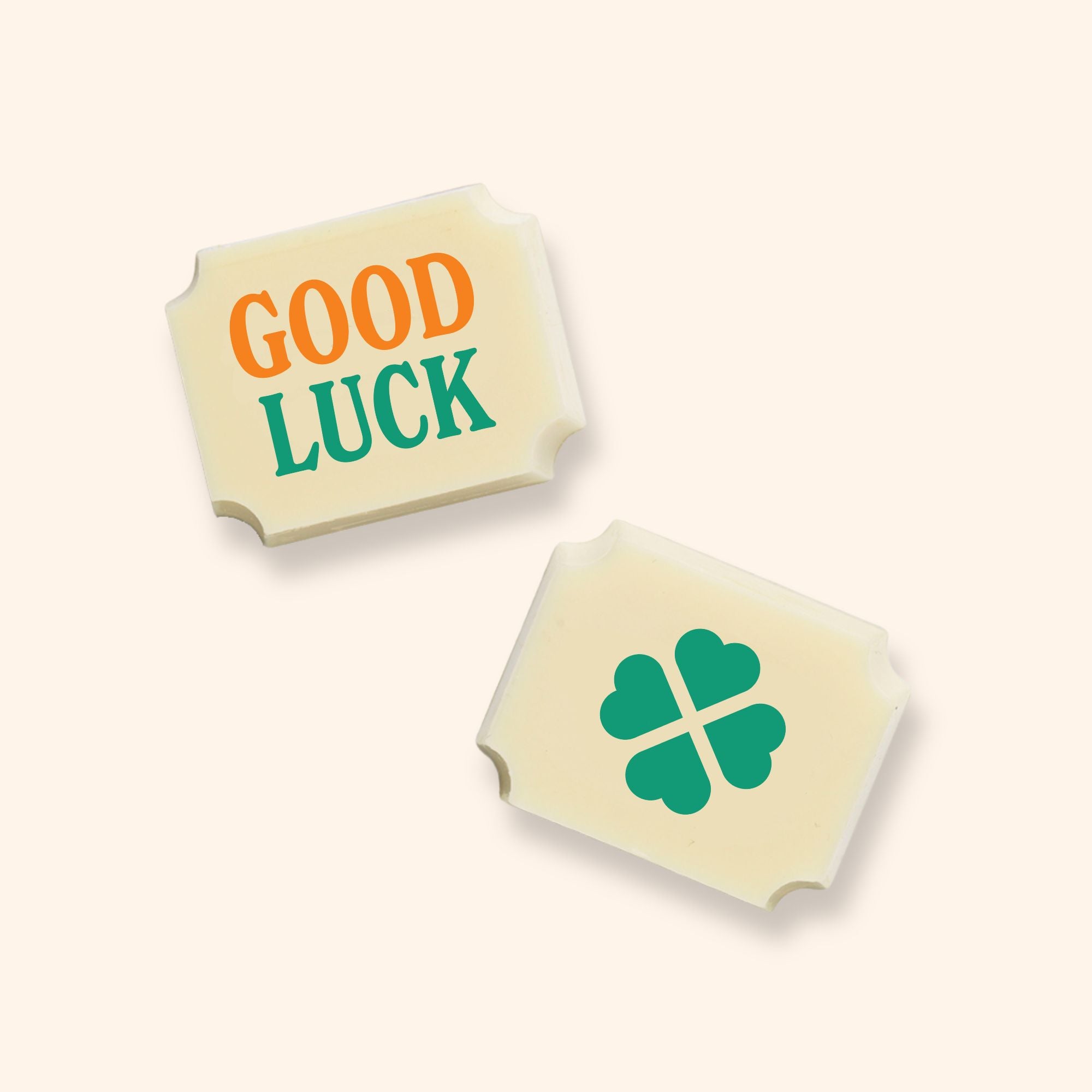 Two luxury white chocolates with a Good Luck message