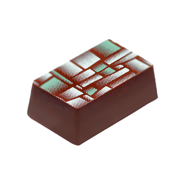 A rectangle shaped chocolate with a green design