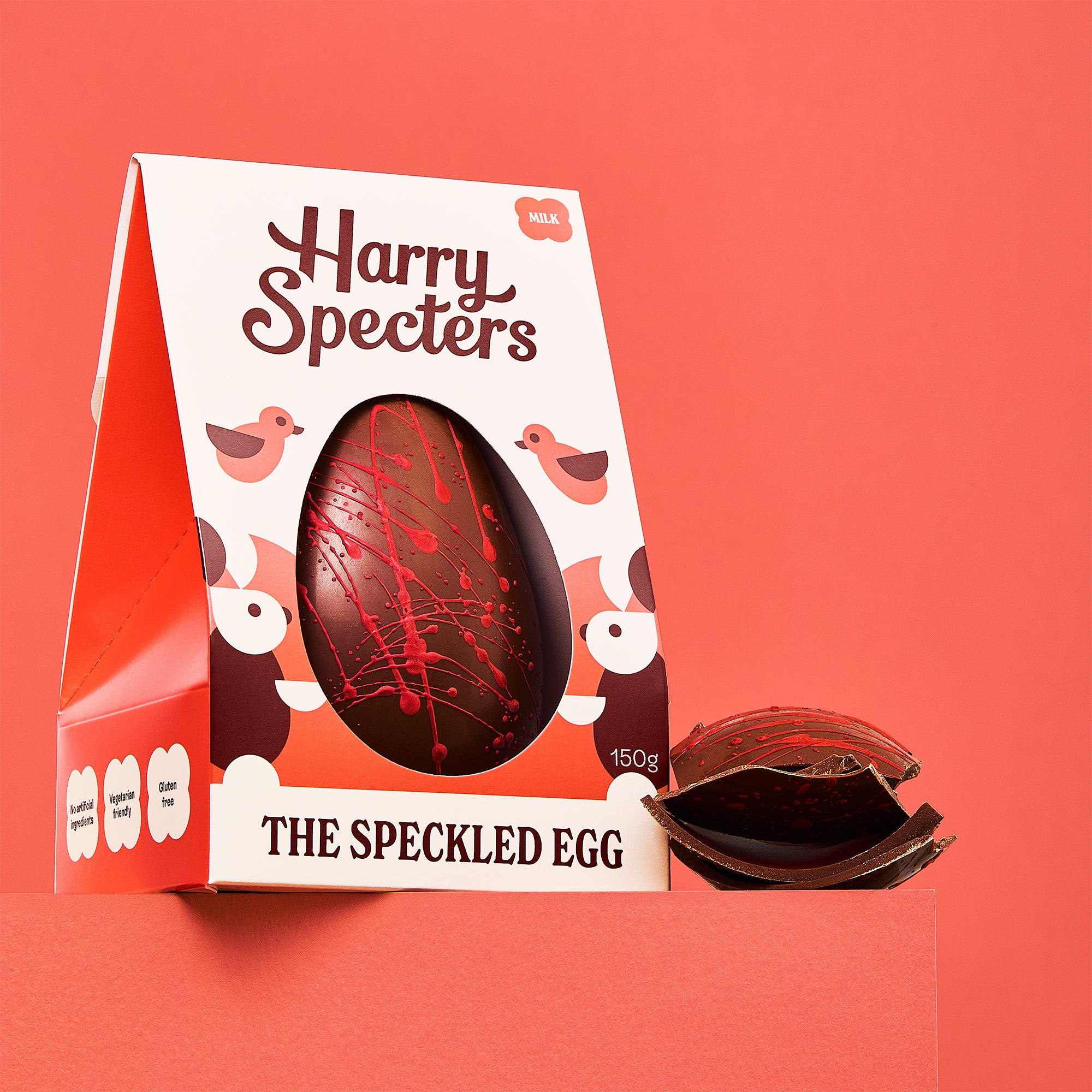 The Speckled Egg is a milk chocolate luxury Easter egg shown on a red background