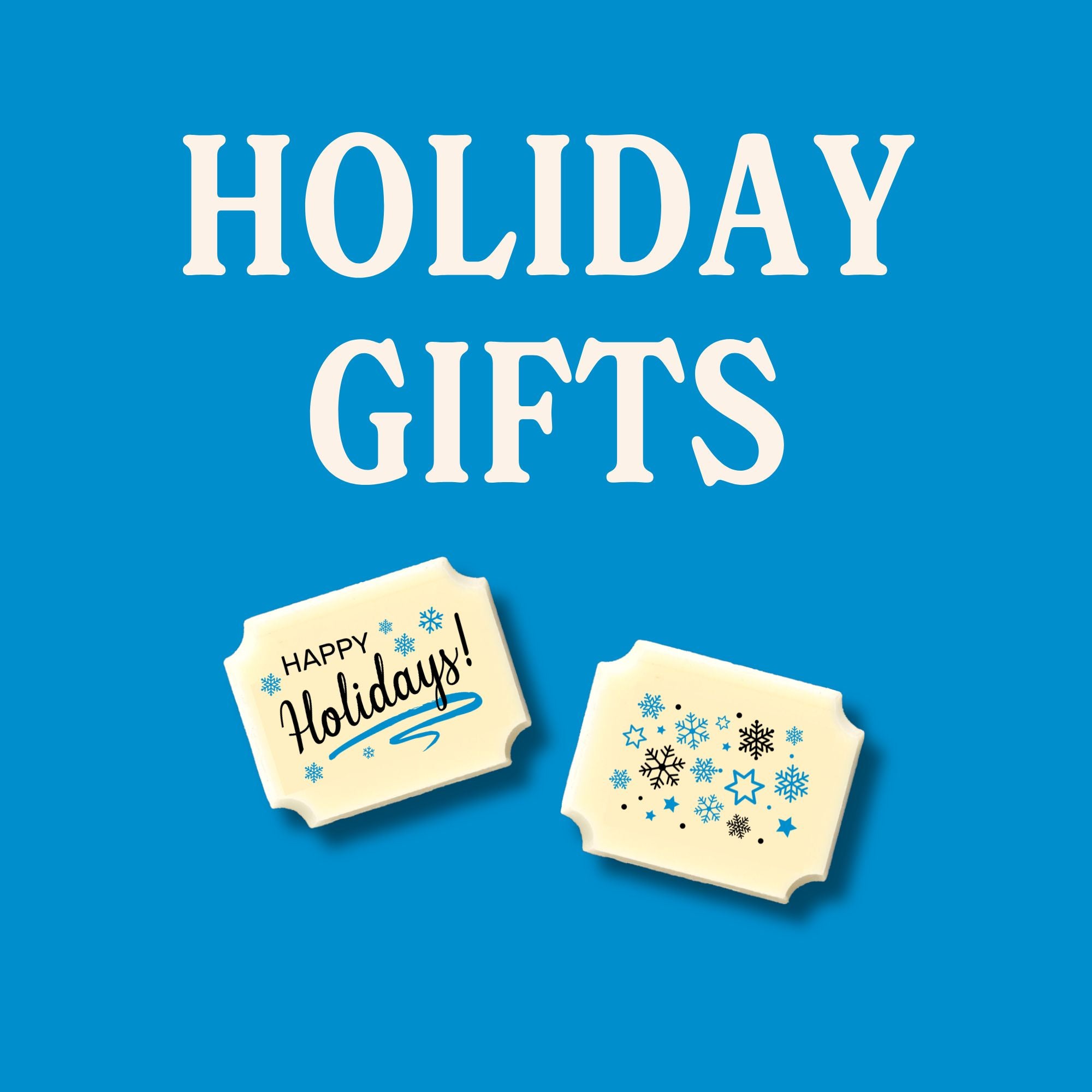 Two luxury white chocolates on a blue background with the words 'Holiday Gifts'