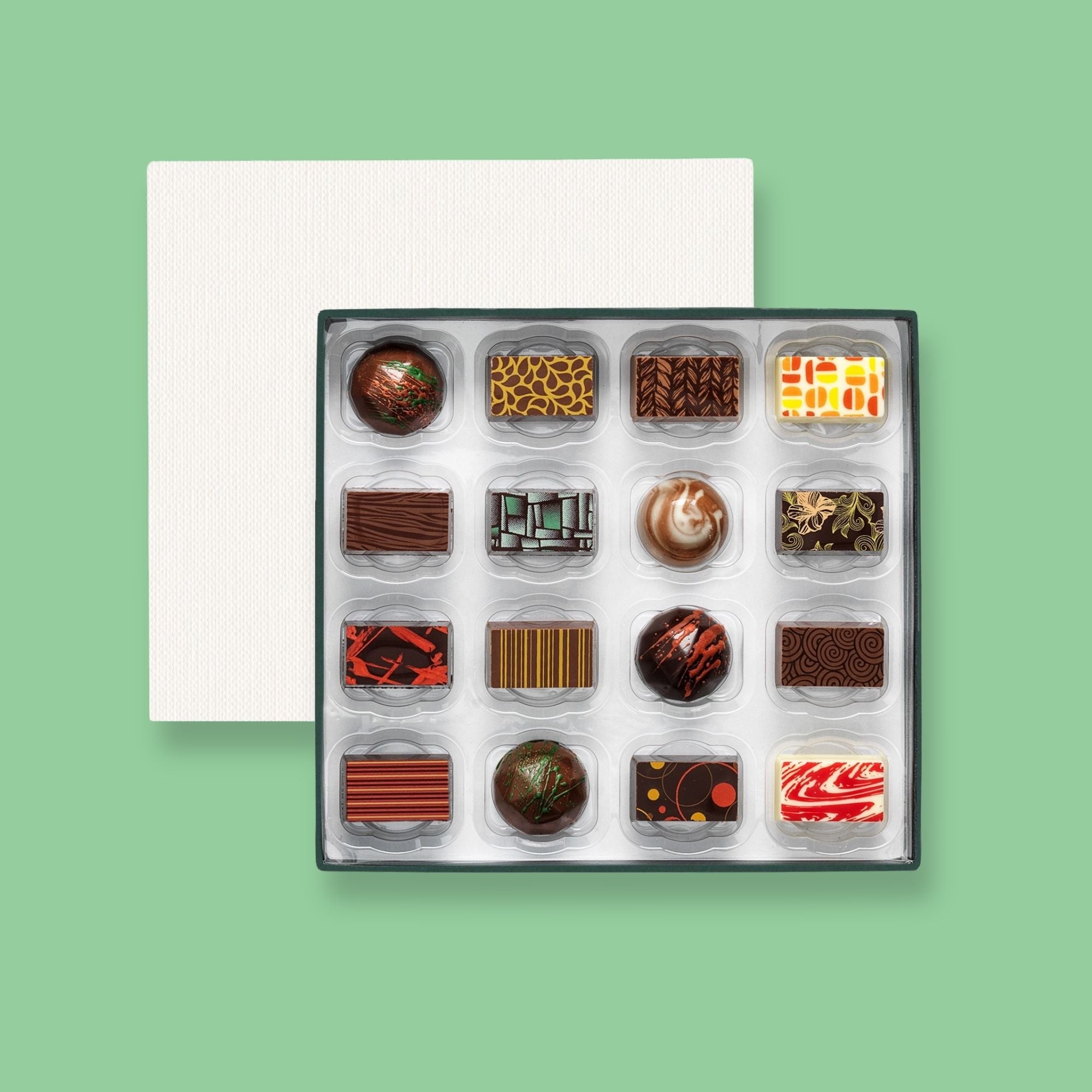 A subscription box of 16 colourfully decorated luxury chocolates 