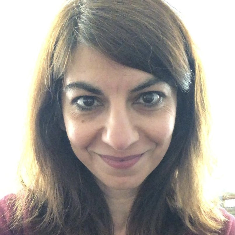 A smiling woman with brown hair