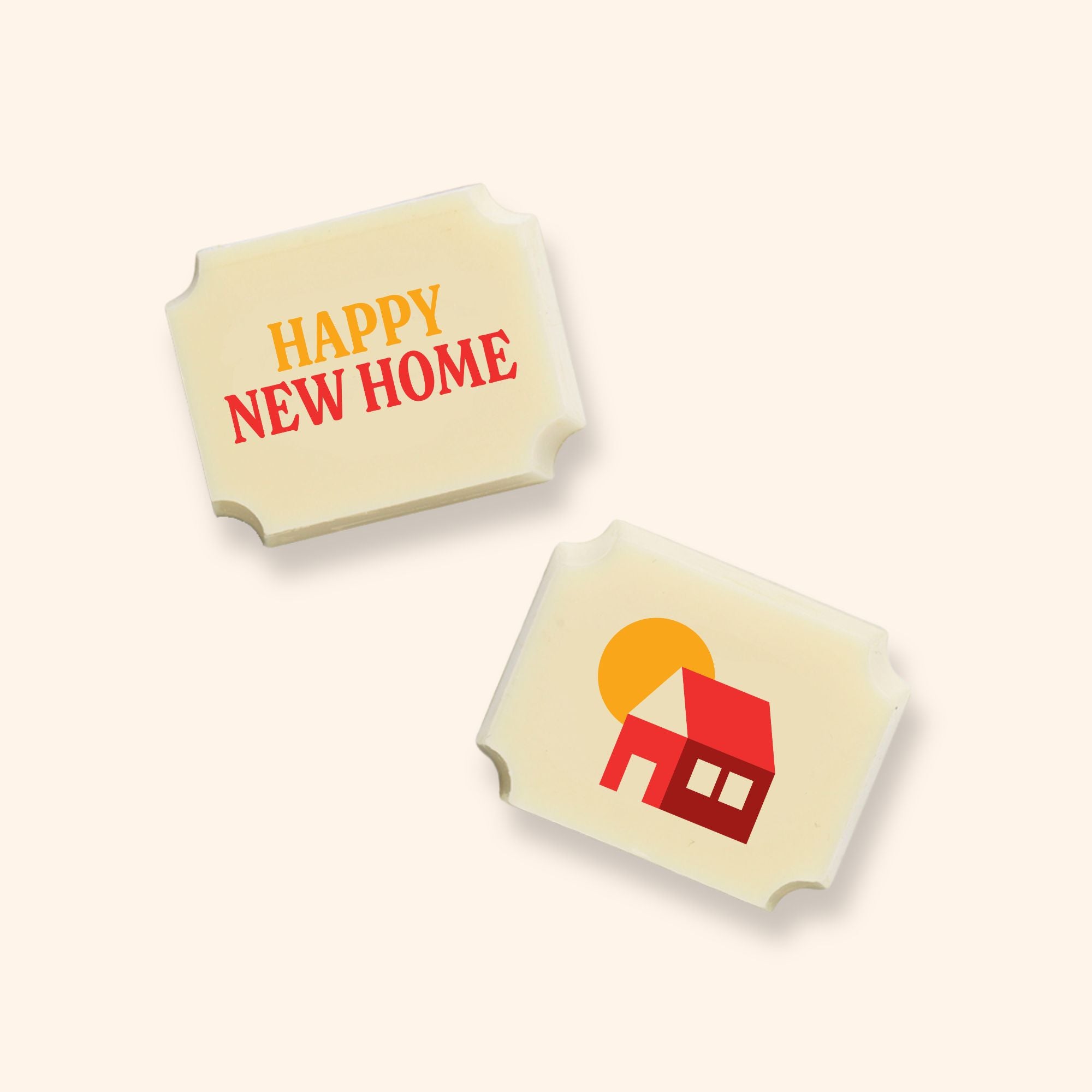 Two luxury white chocolates with a Happy New Home message