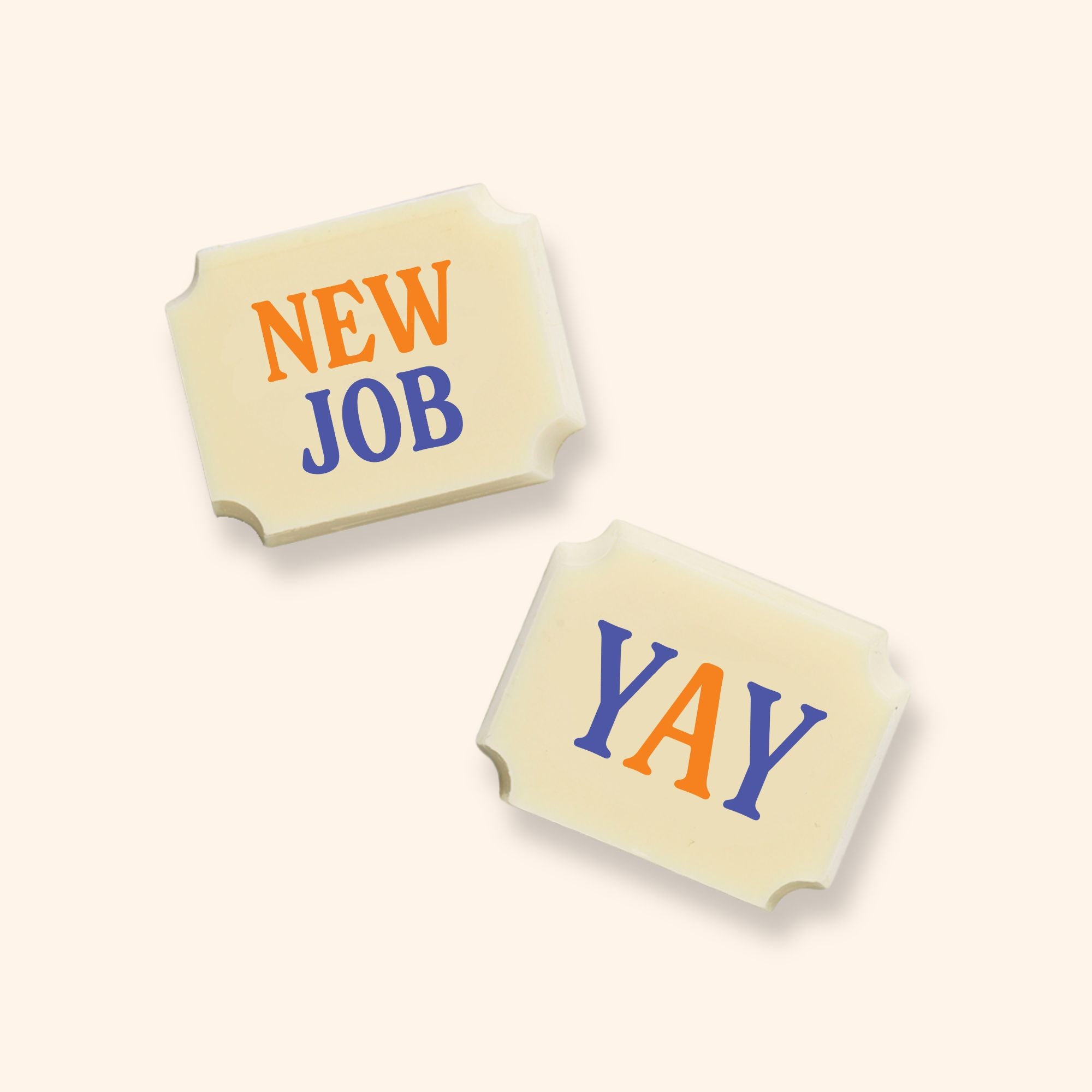 Two luxury white chocolates with a New Job message