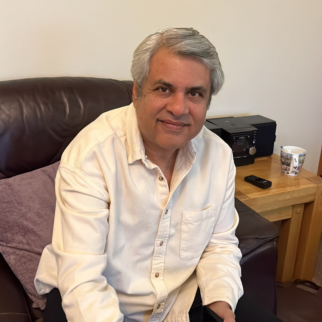 A smiling man with grey hair
