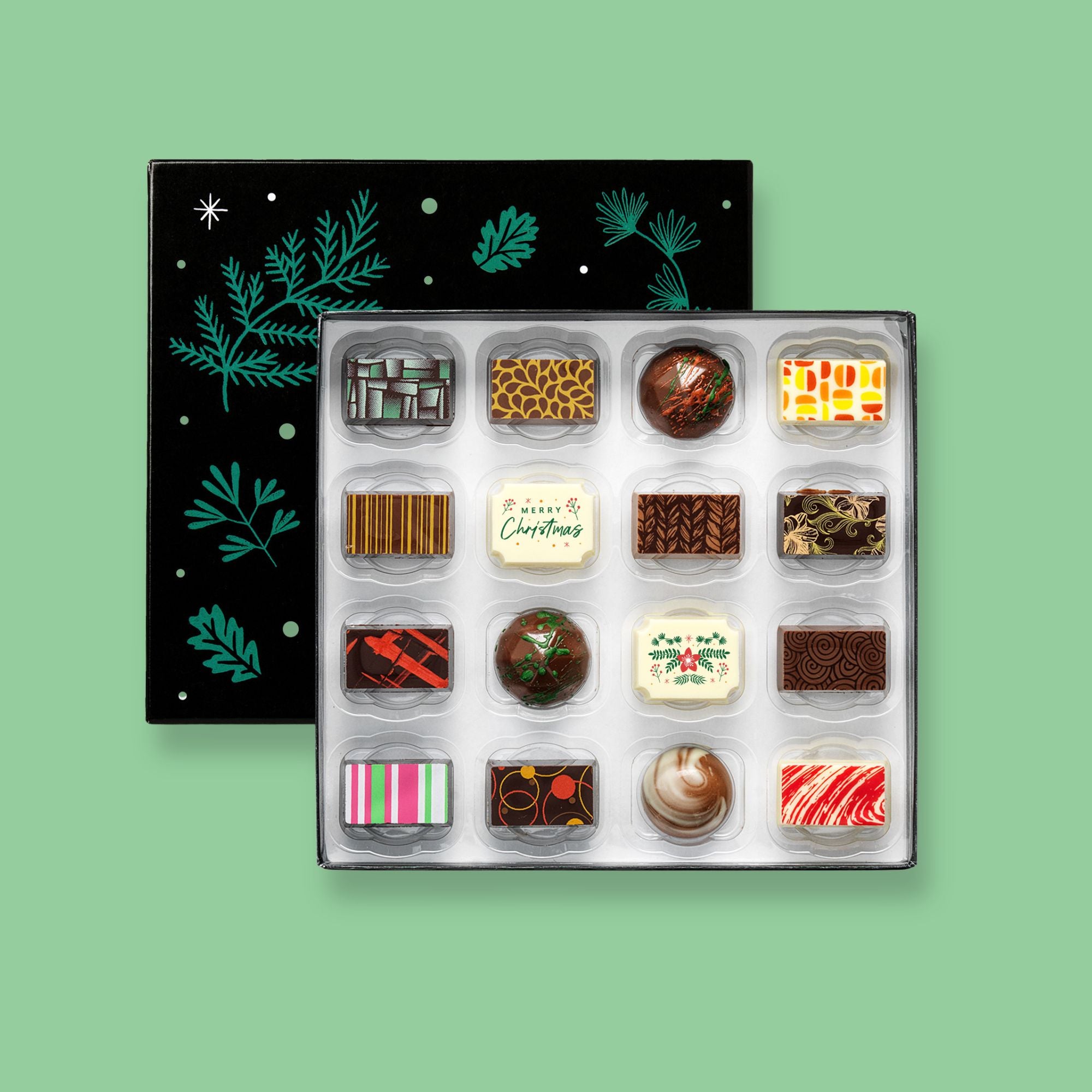 A festive box of 16 artisan chocolates colourfully decorated and featuring two Christmas themed designs
