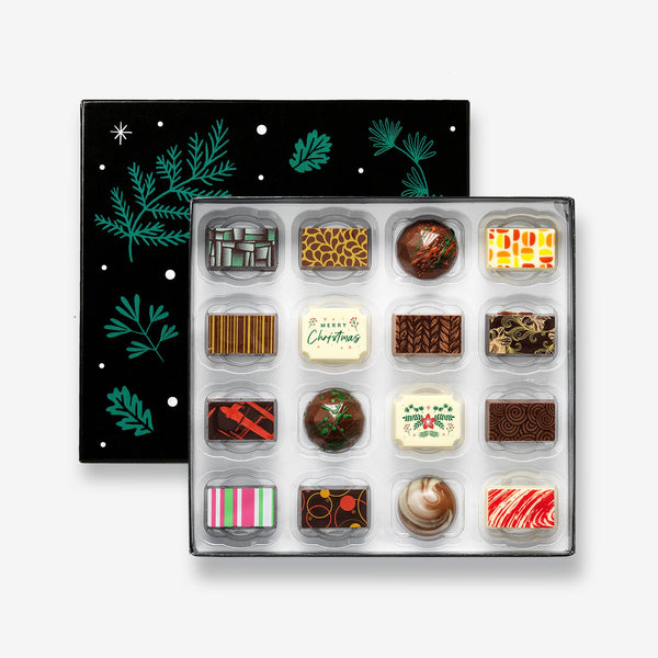 A festive box of 16 artisan chocolates colourfully decorated and featuring two Christmas themed designs