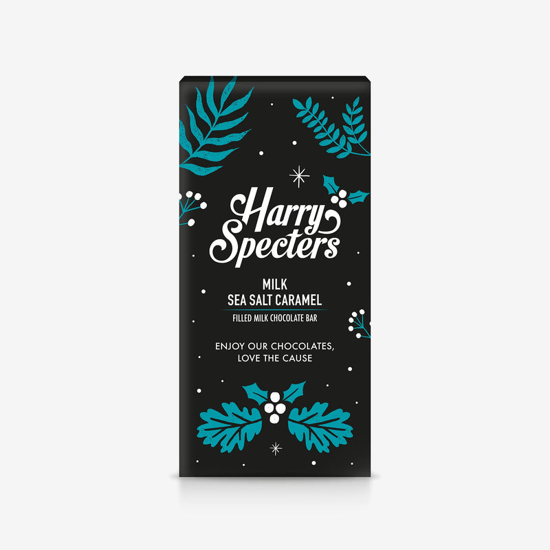 A Harry Specters milk chocolate bar filled with sea salt caramel in festive Christmas packaging