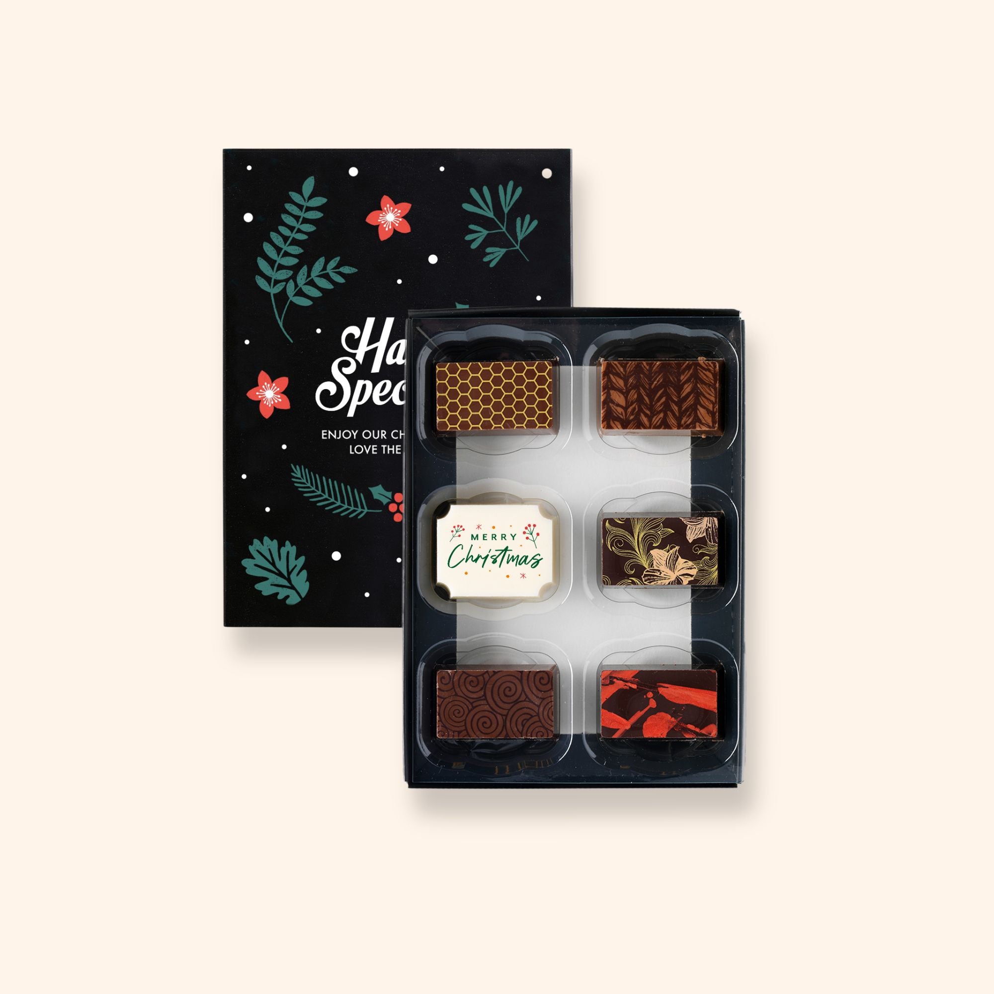 A box of 6 artisan chocolates colourfully decorated and featuring one Christmas themed designs