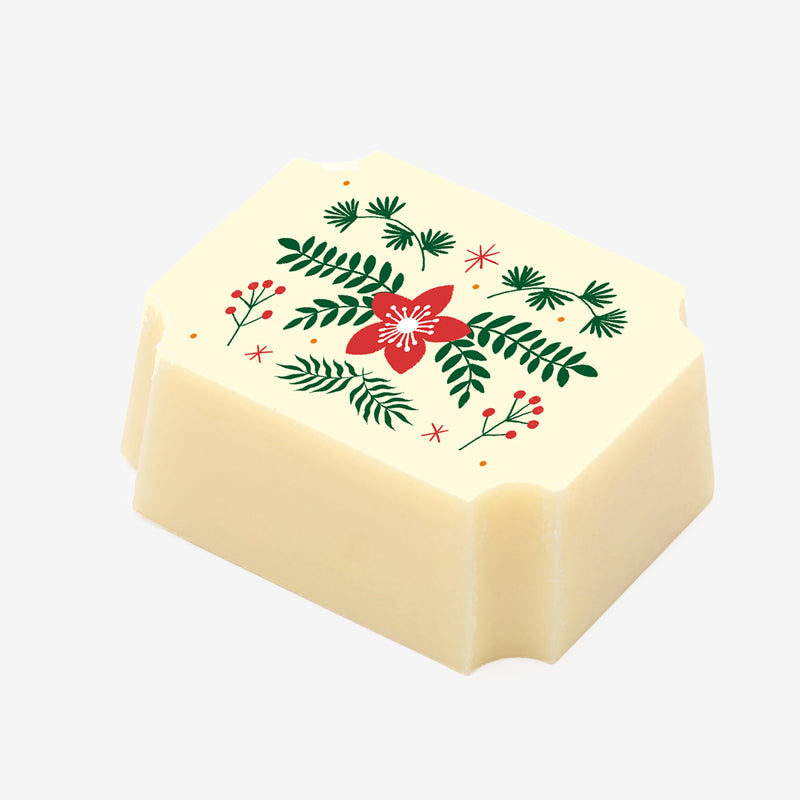 A white chocolate with a festive Christmas flower design 