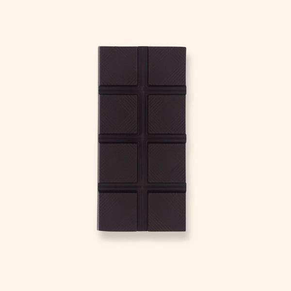 A vegan dark chocolate bar with caramel crunch pieces