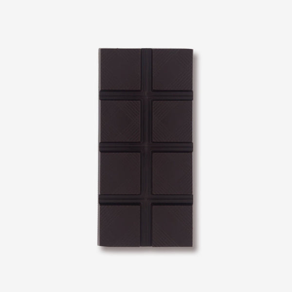 A vegan dark chocolate bar with caramel crunch pieces