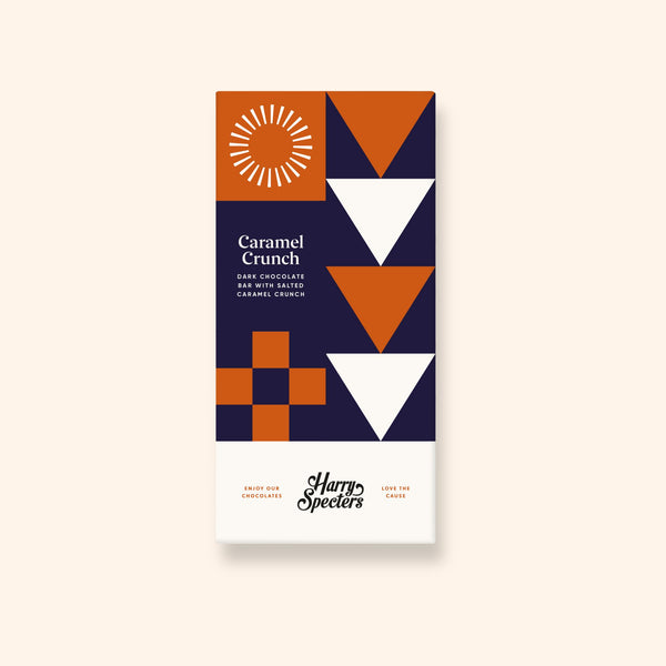 A vegan dark chocolate bar with caramel crunch pieces by Harry Specters in colourful packaging