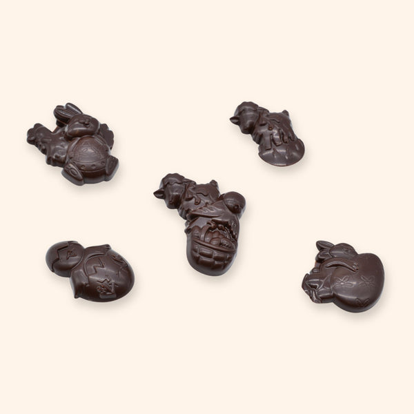 A pile of vegan dark chocolate Easter bunny shapes