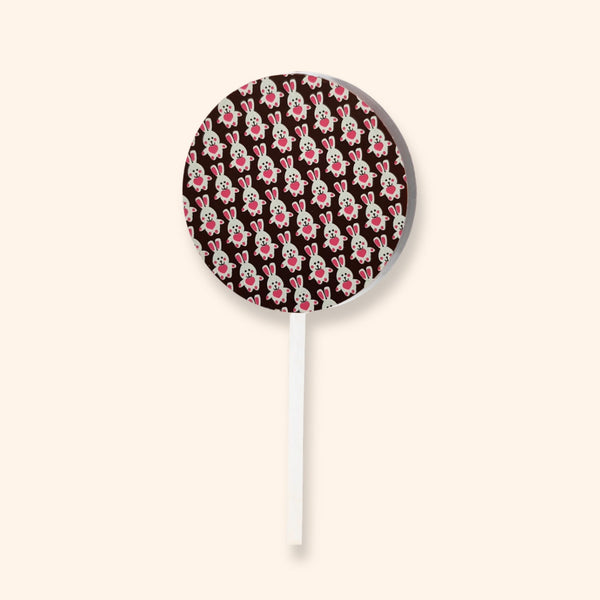 A dark chocolate lollipop featuring an Easter bunny design