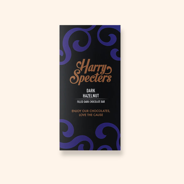 A vegan dark chocolate bar by Harry Specters filled with hazelnut shown in colourful packaging