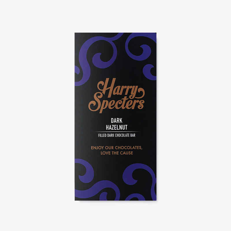 A vegan dark chocolate bar by Harry Specters filled with hazelnut shown in colourful packaging