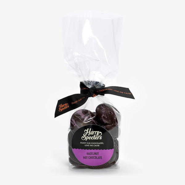 A bag of dark hot chocolate buttons filled with hazelnut