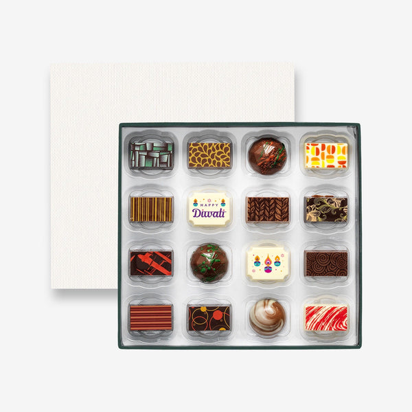 A box of 16 artisan chocolates colourfully decorated and featuring two Diwali themed designs