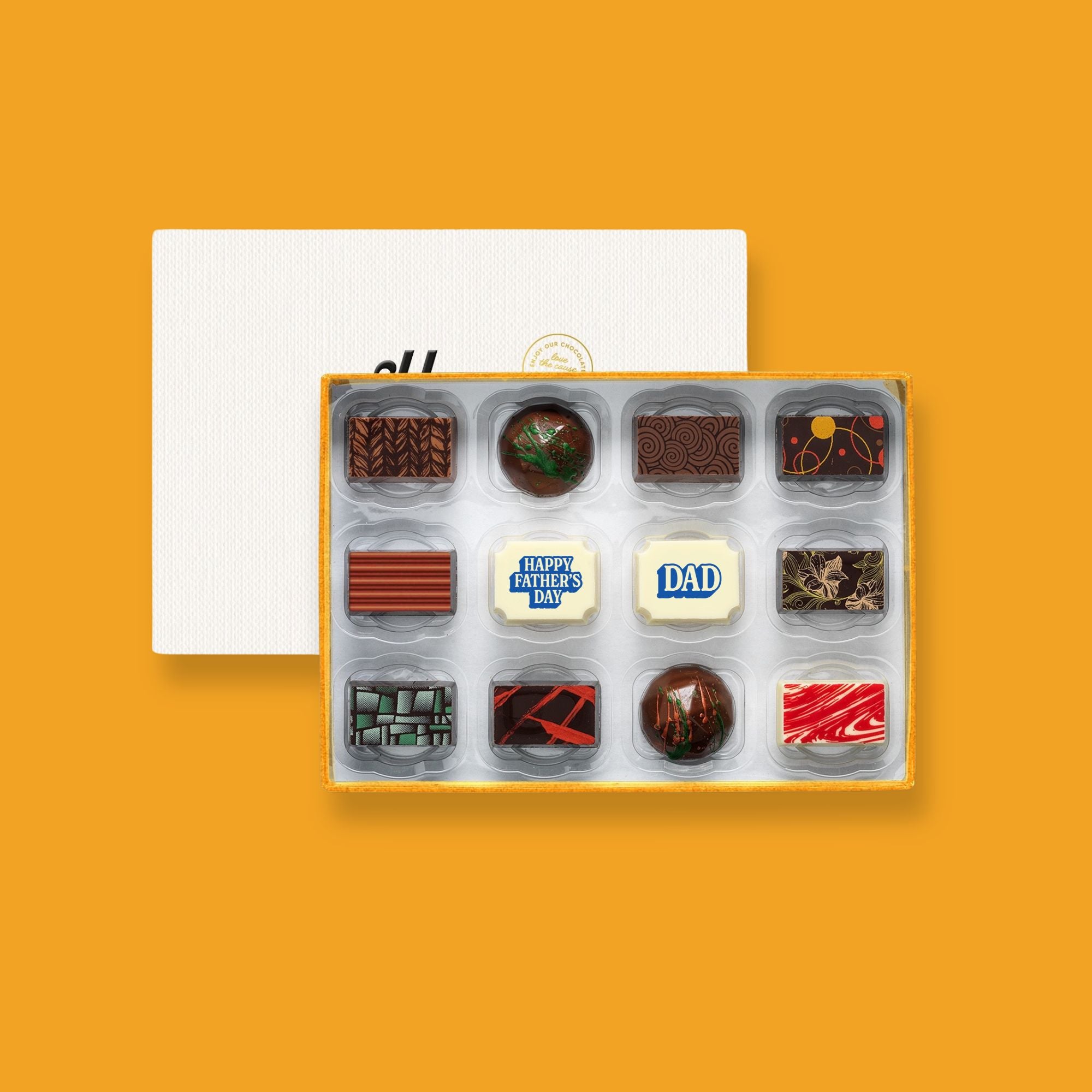 A box of 12 artisan chocolates colourfully decorated and featuring two Father's Day themed designs