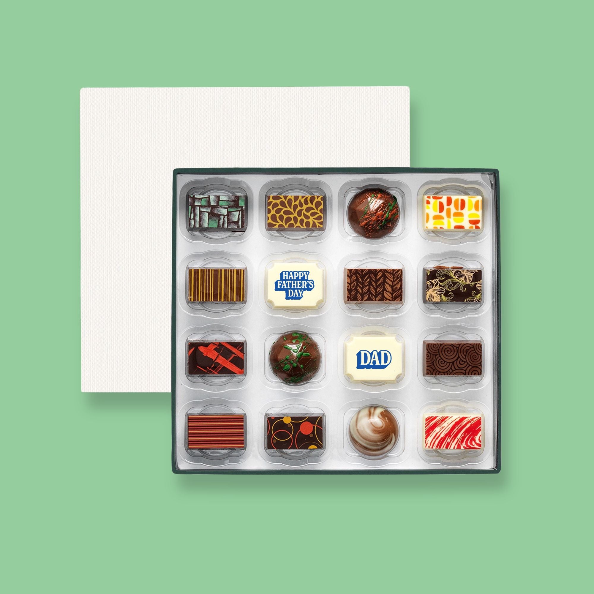 A box of 16 artisan chocolates colourfully decorated and featuring two Father's Day themed designs
